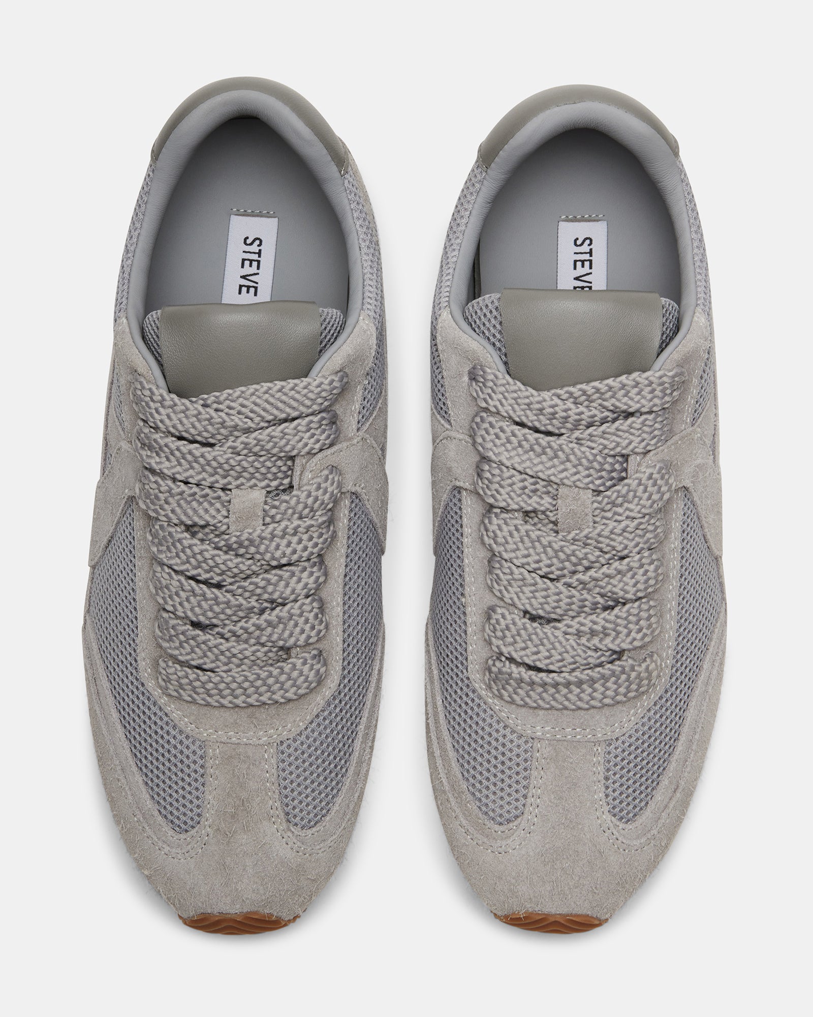 Close-up of Stride Grey Suede sneakers showing lace-up design