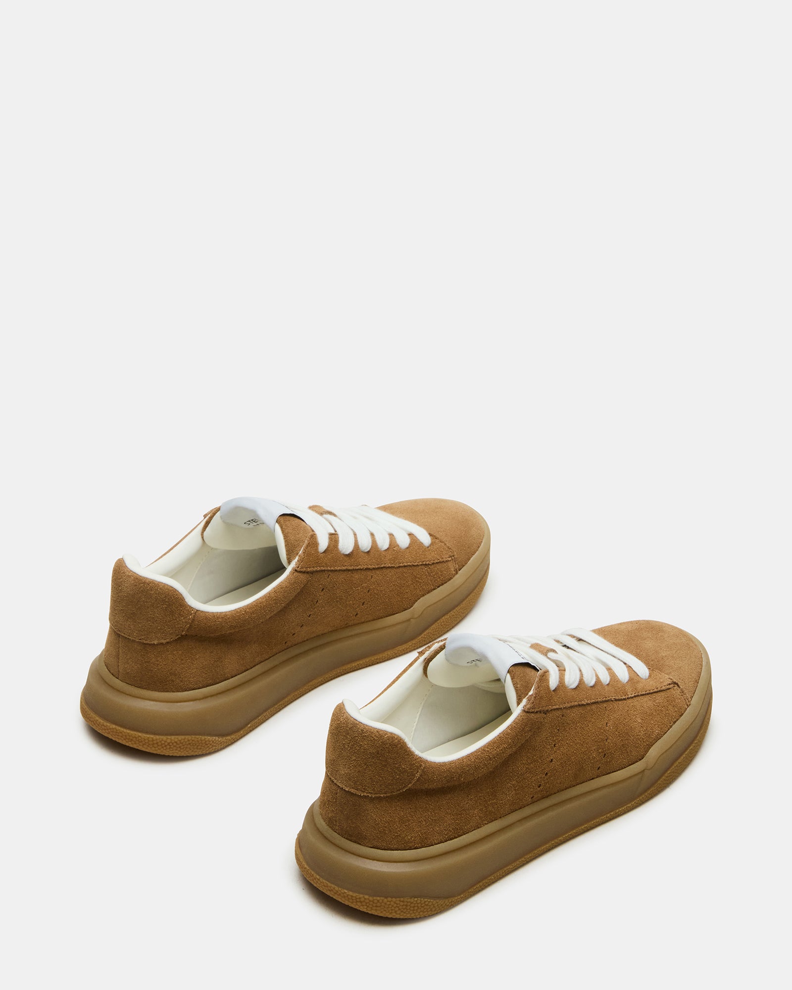 Side view of womens black sneakers highlighting the low-top design