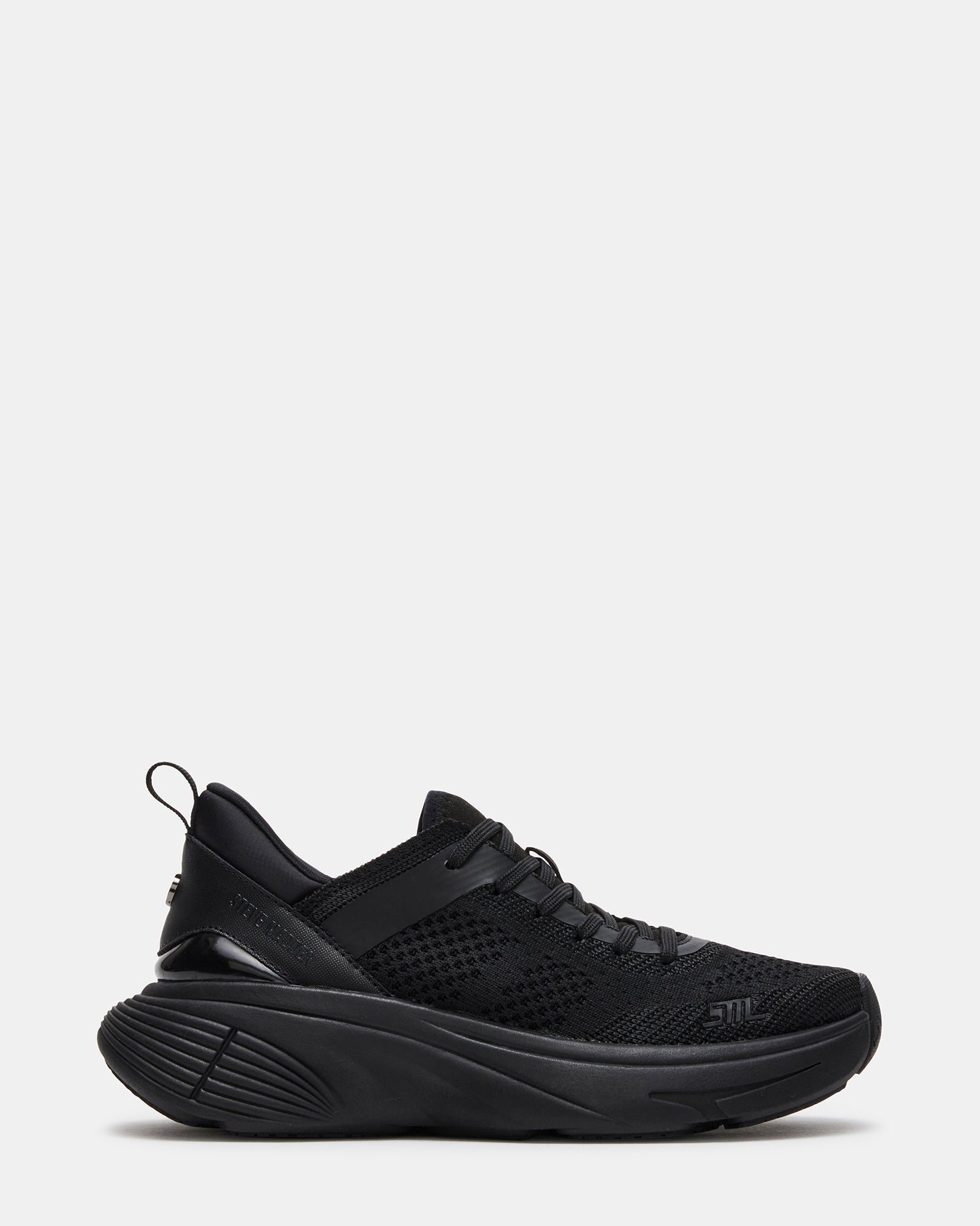 Stylus black platform sneakers styled with jeans for a casual look