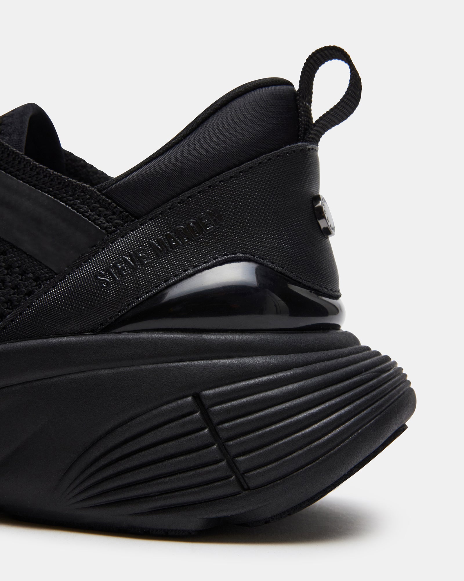 Stylus black platform sneakers styled with jeans for a casual look