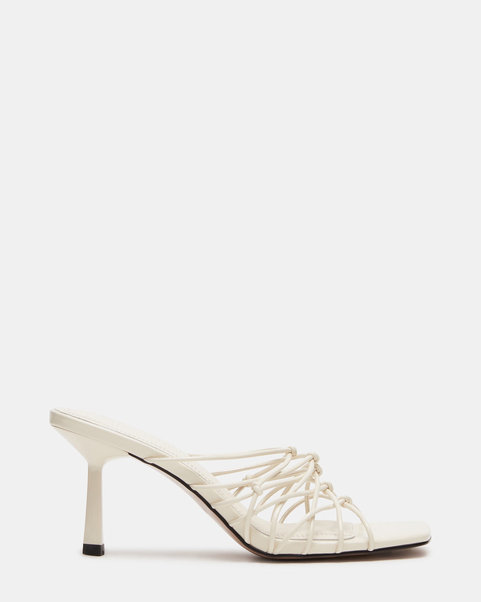 Nude strappy heels showcasing square toe design.