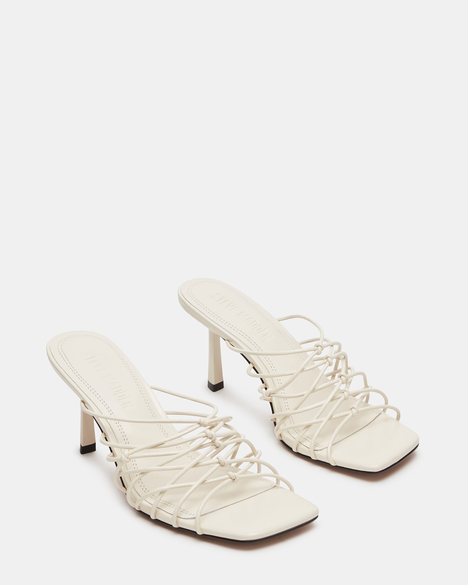 Stylish silver strappy heels worn for a night out.