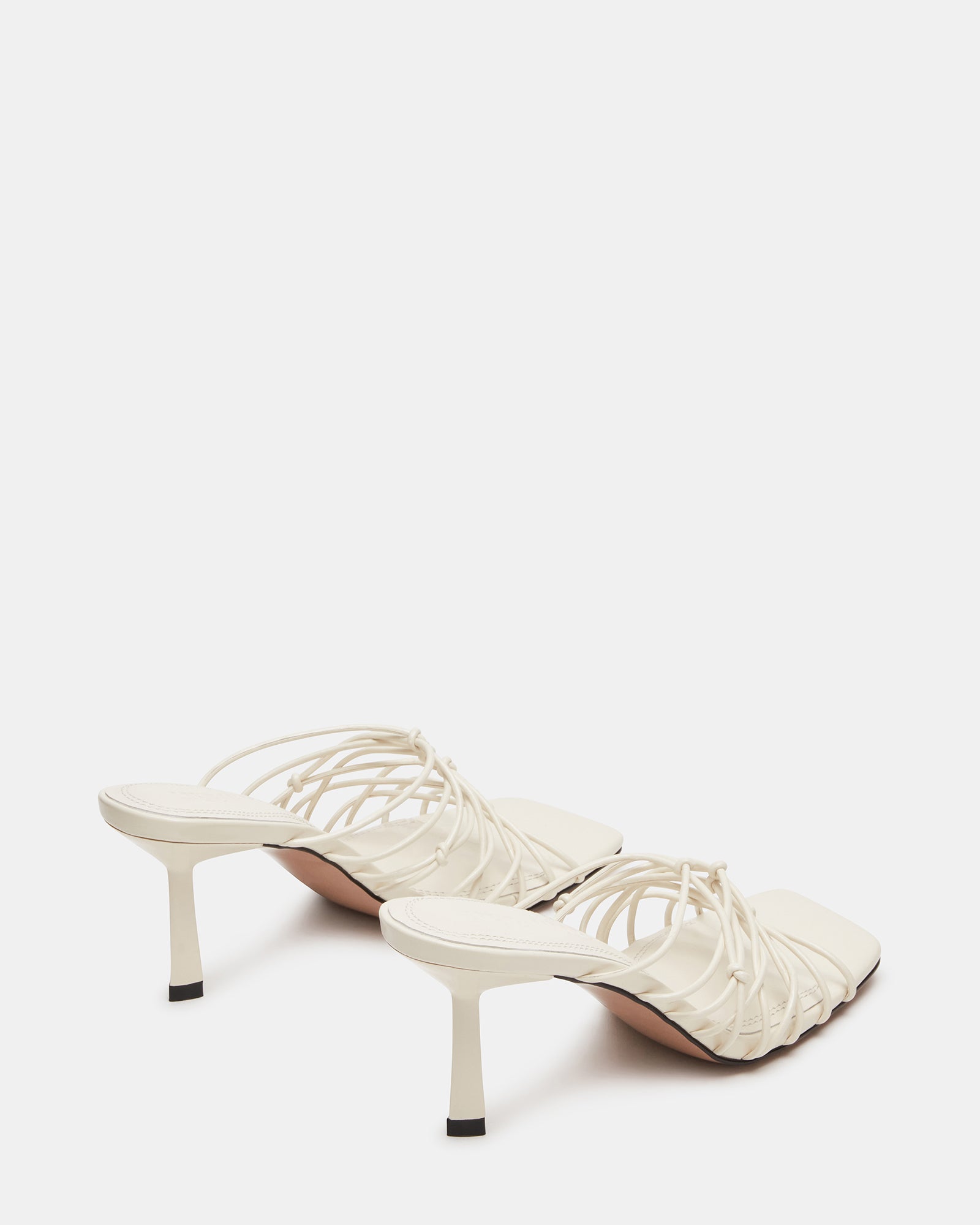Stylish silver strappy heels worn for a night out.