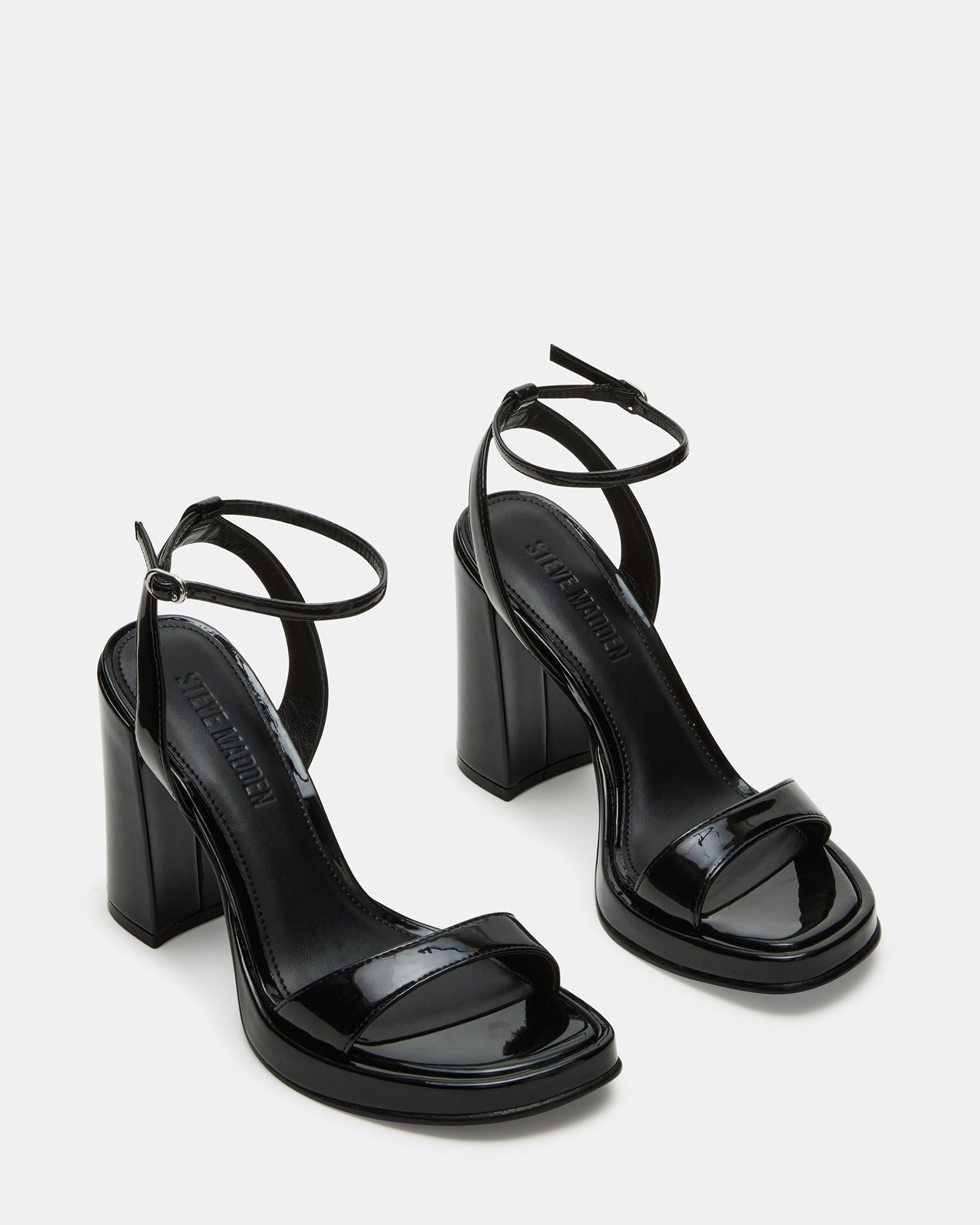 Rear angle of block heel shoes sandals styled for Chicago rooftop evening