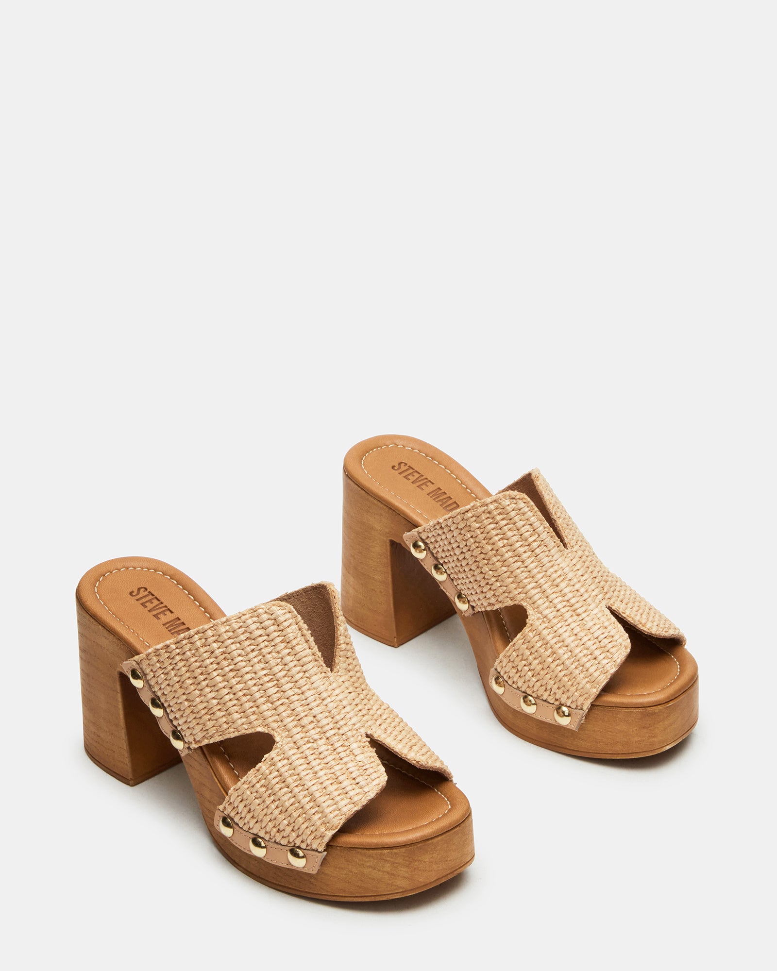 Flat lay of raffia platform sandals with natural textures and trendy design