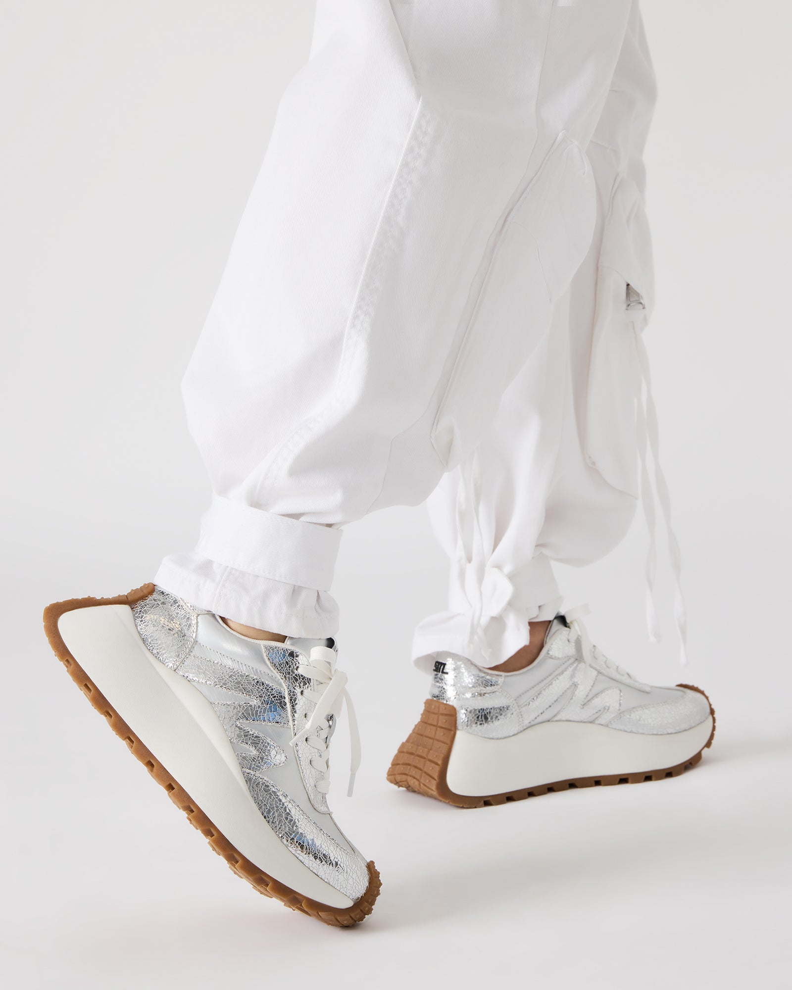 Women wearing Supercampo sneakers with casual outfit in urban setting