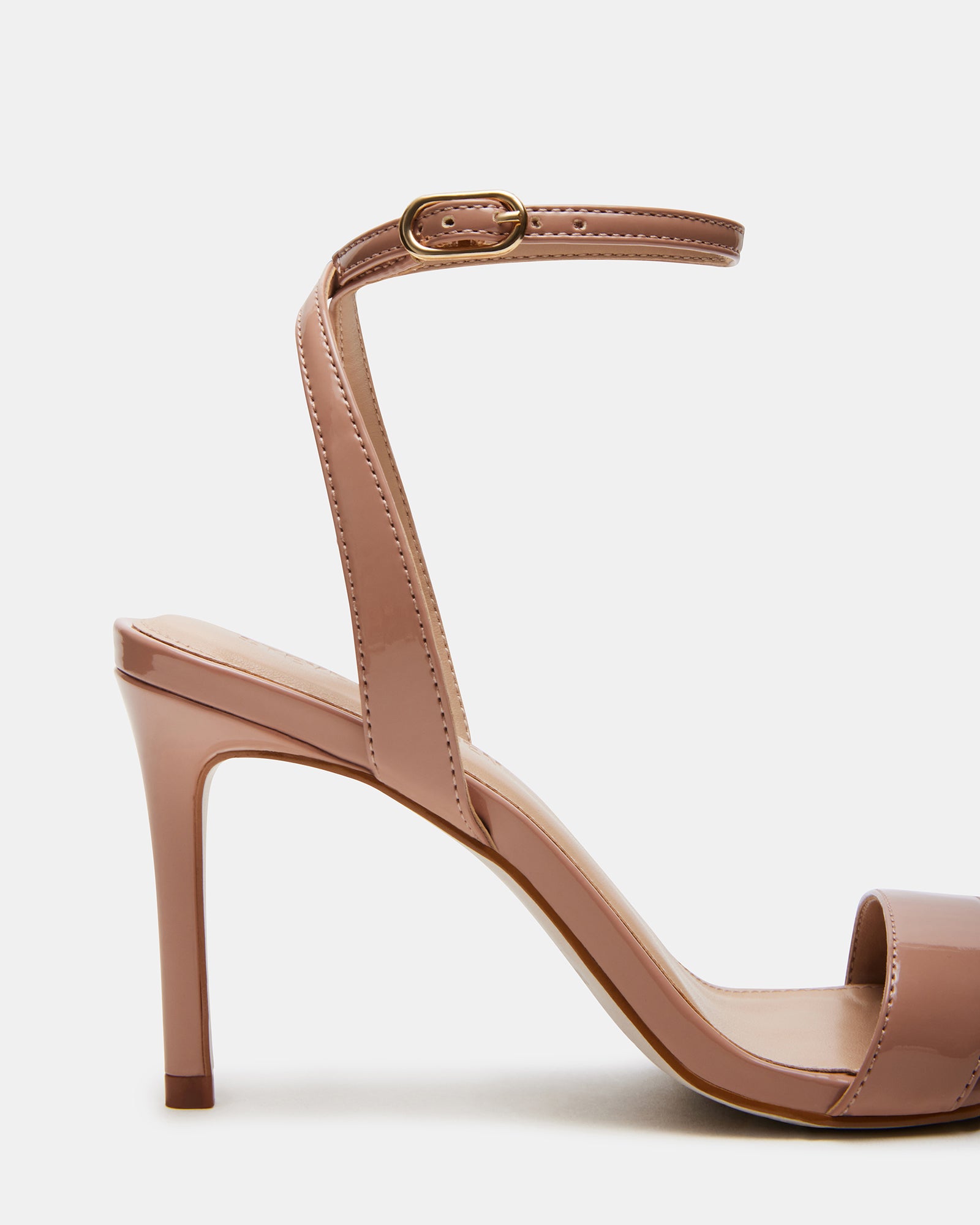 Side profile of platform stiletto heels highlighting ankle strap