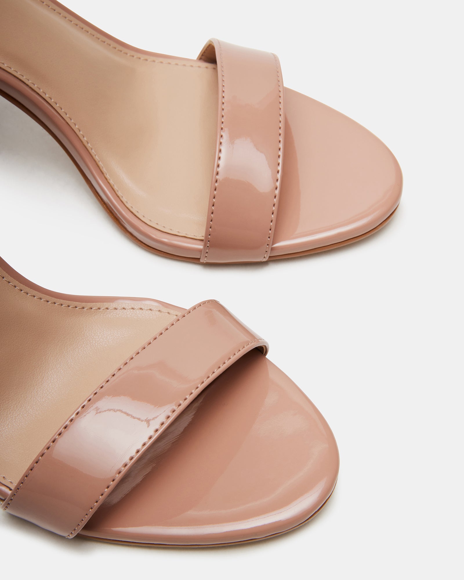 Close-up of Suzie ankle strap heel shoes showing patent finish