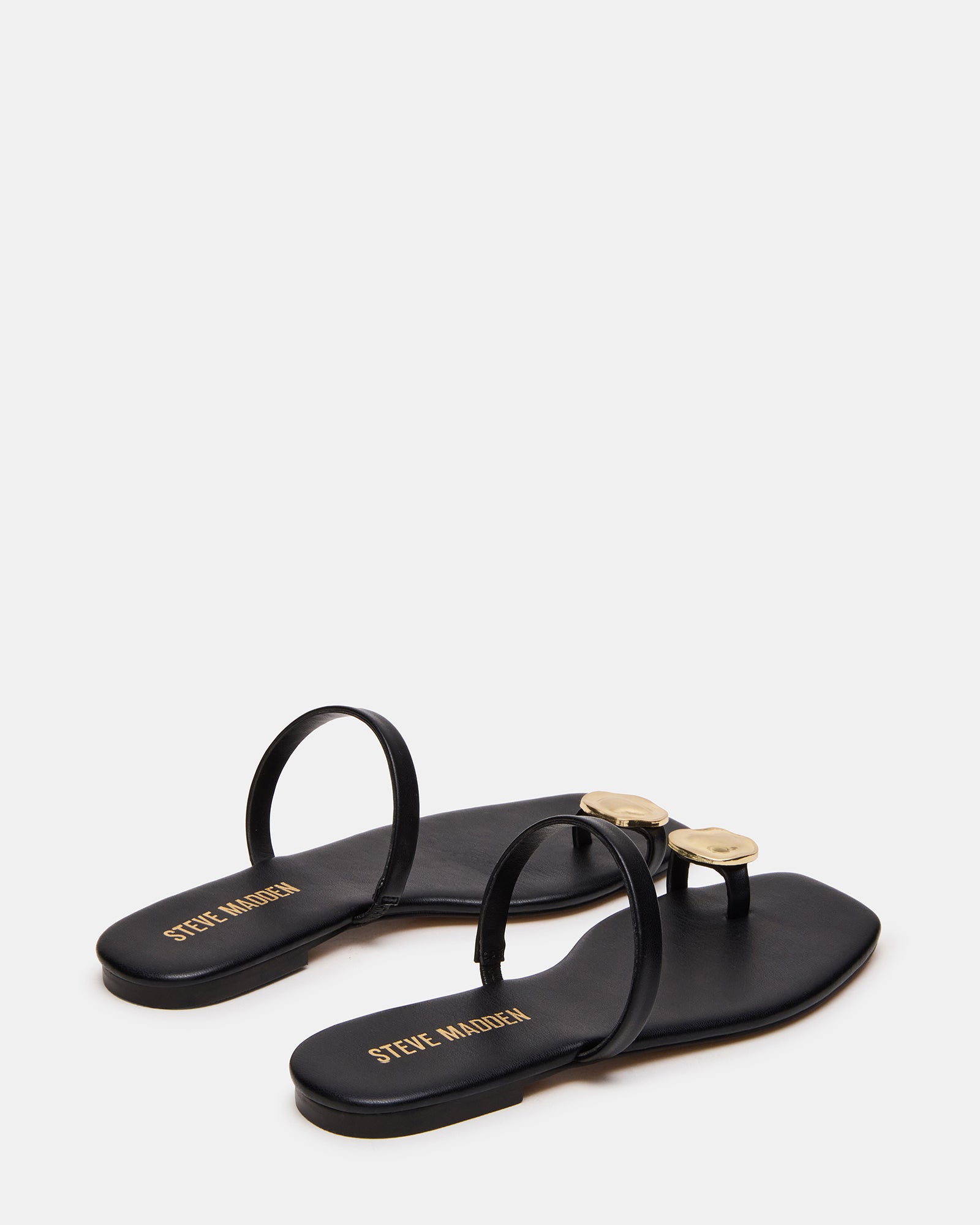 Top view of vegan leather black sandals highlighting the square-toe style.