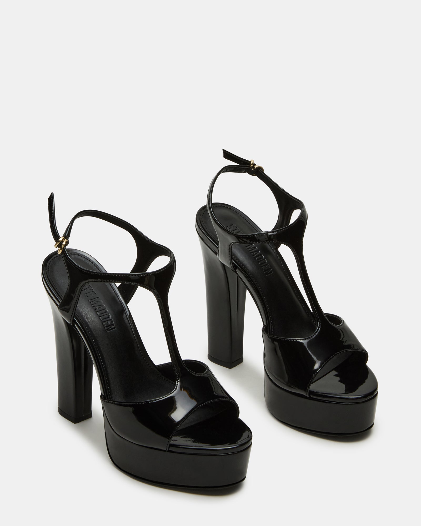 Close-up of strappy sandals design showing patent leather finish