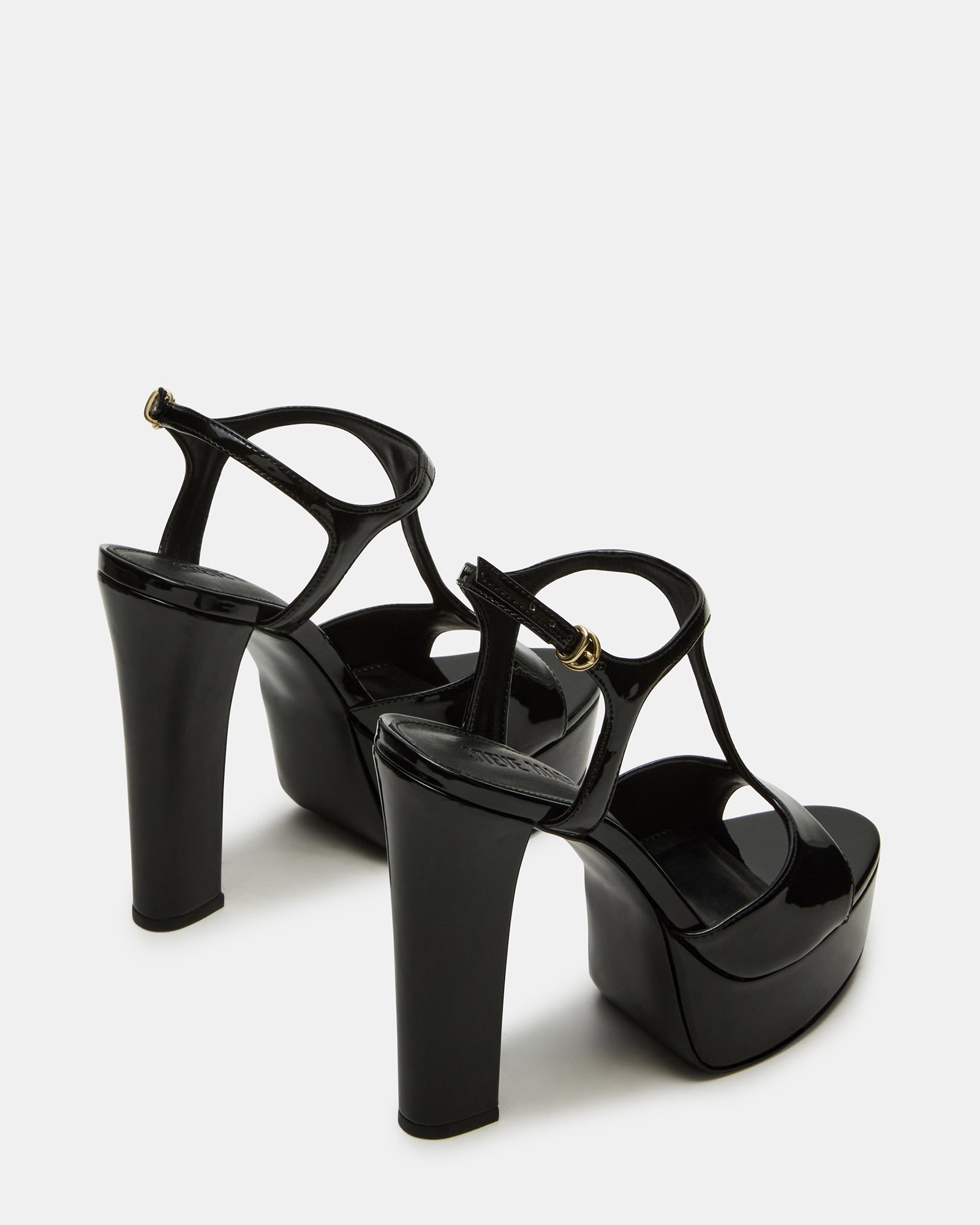Close-up of strappy sandals design showing patent leather finish