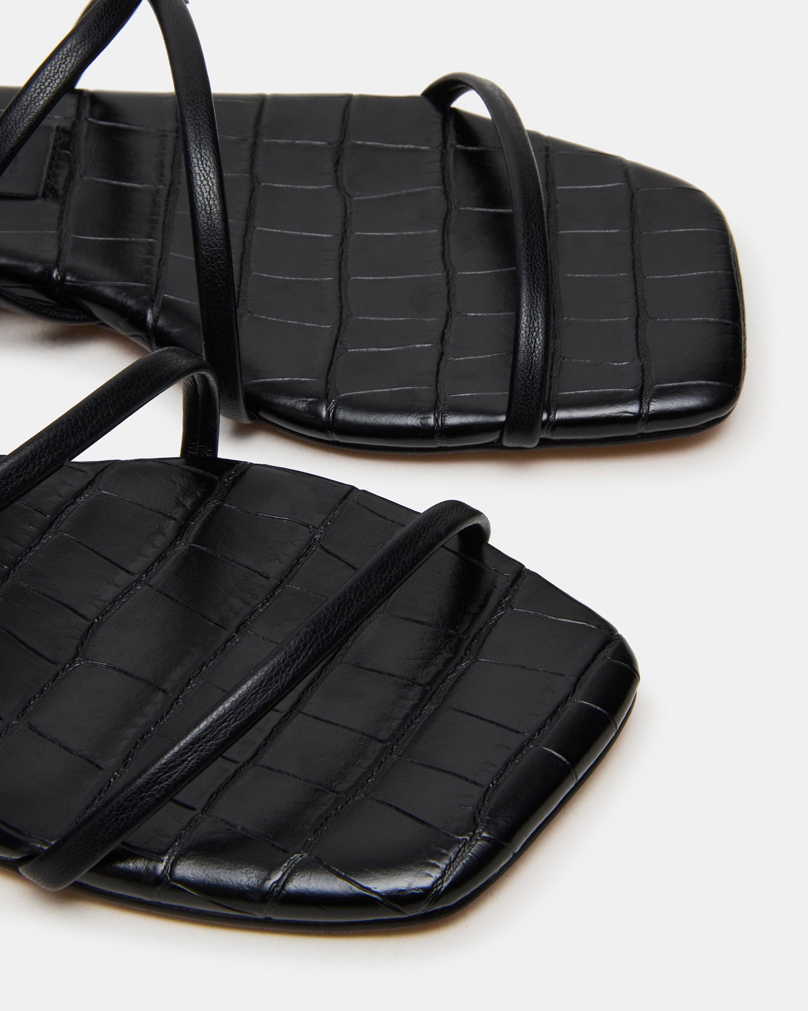 Side view of womens dress sandals black with square toe design.