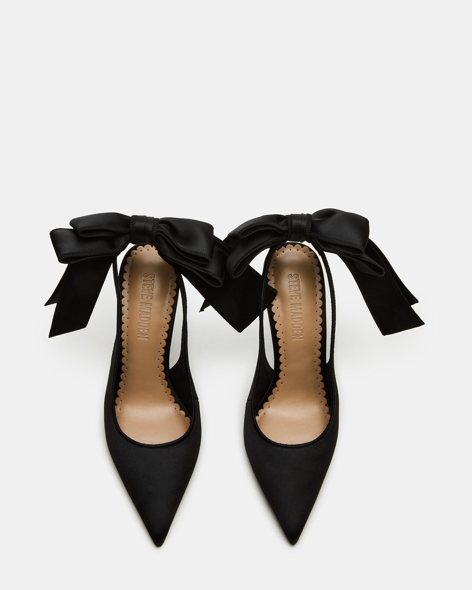 Close-up of the bow detail on the Teacup black satin heels.