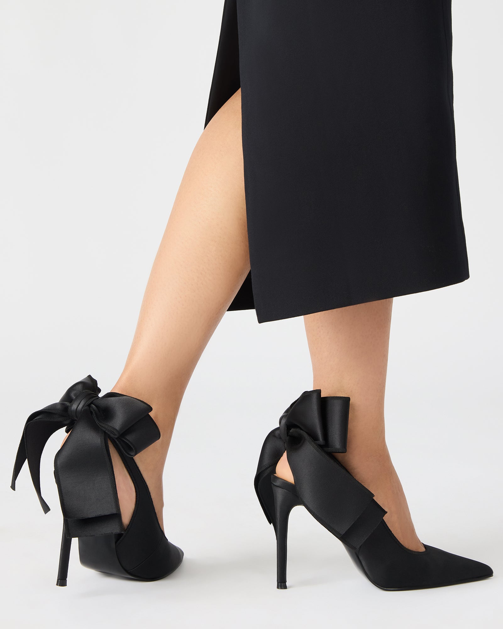 Close-up of the bow detail on the Teacup black satin heels.