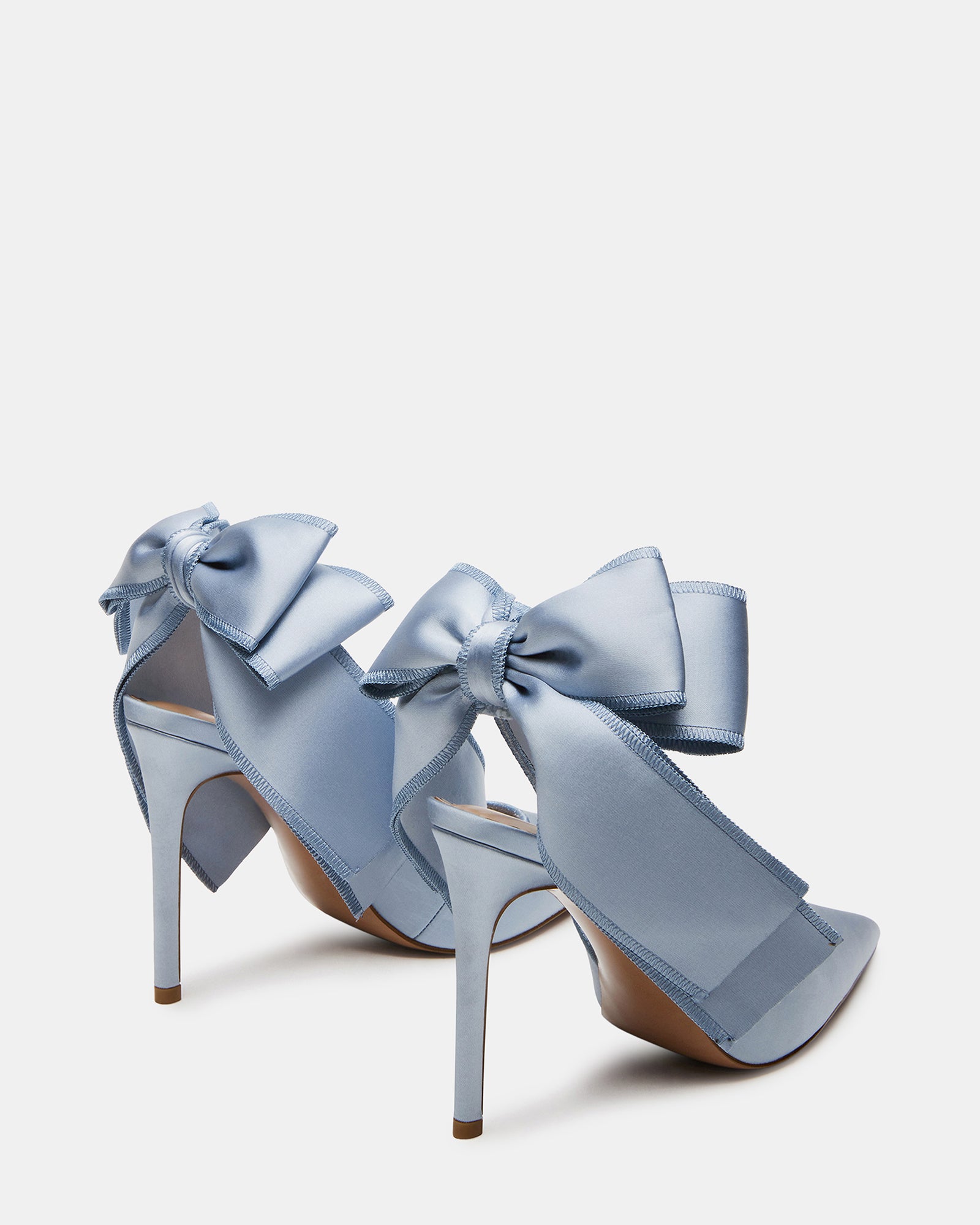 Close-up of the heel and pointed toe design on blue satin slingbacks