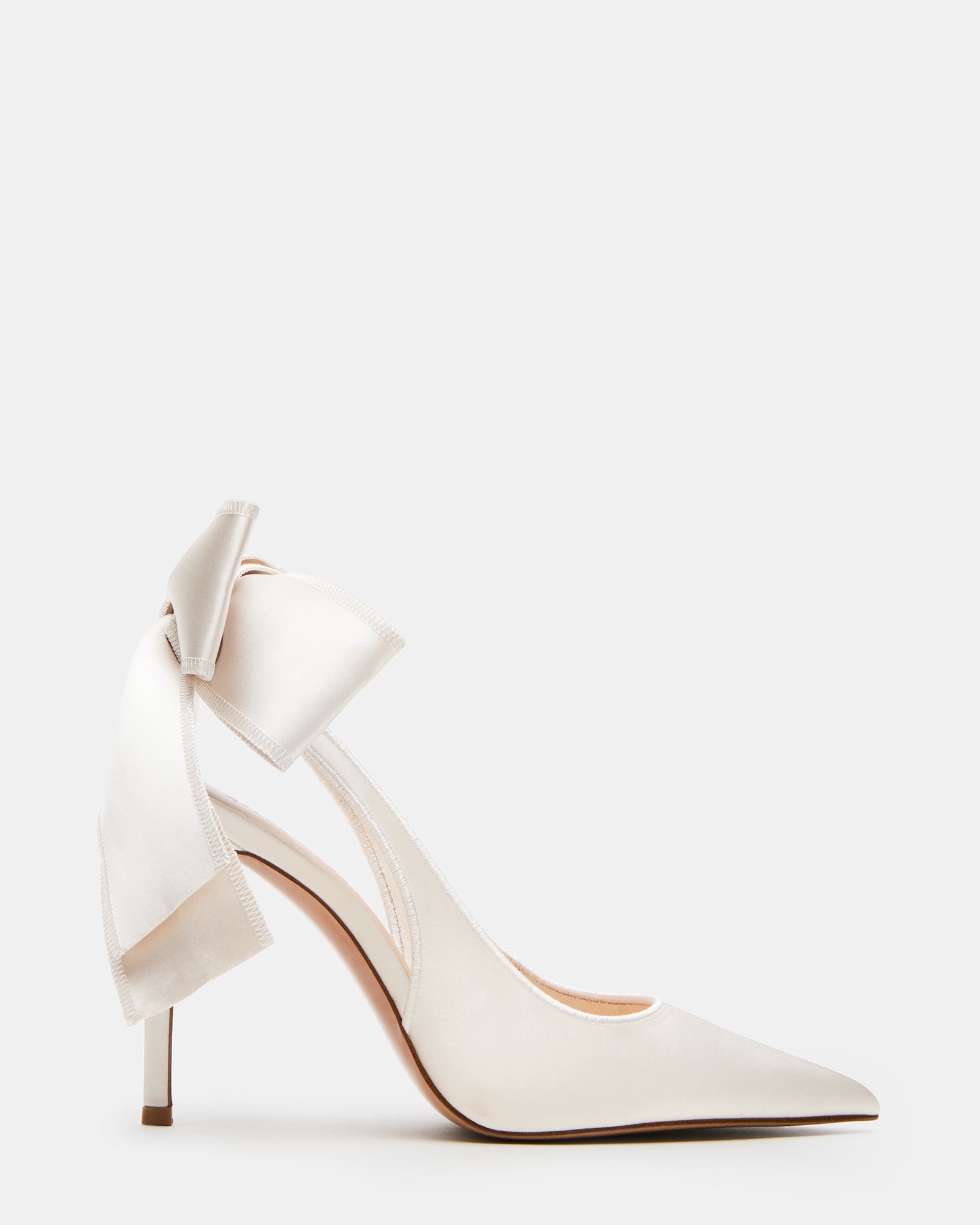Close-up of ivory satin slingback heels with pointed toe and bow