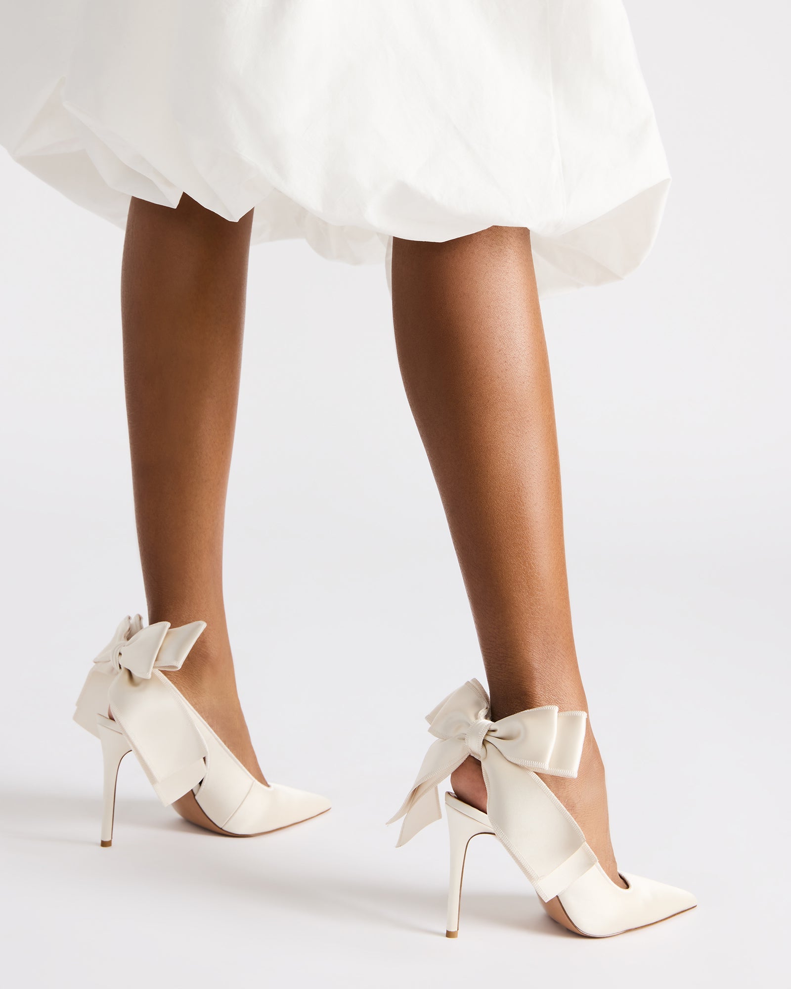 Model wearing Teacup heels with a cocktail dress in NYC