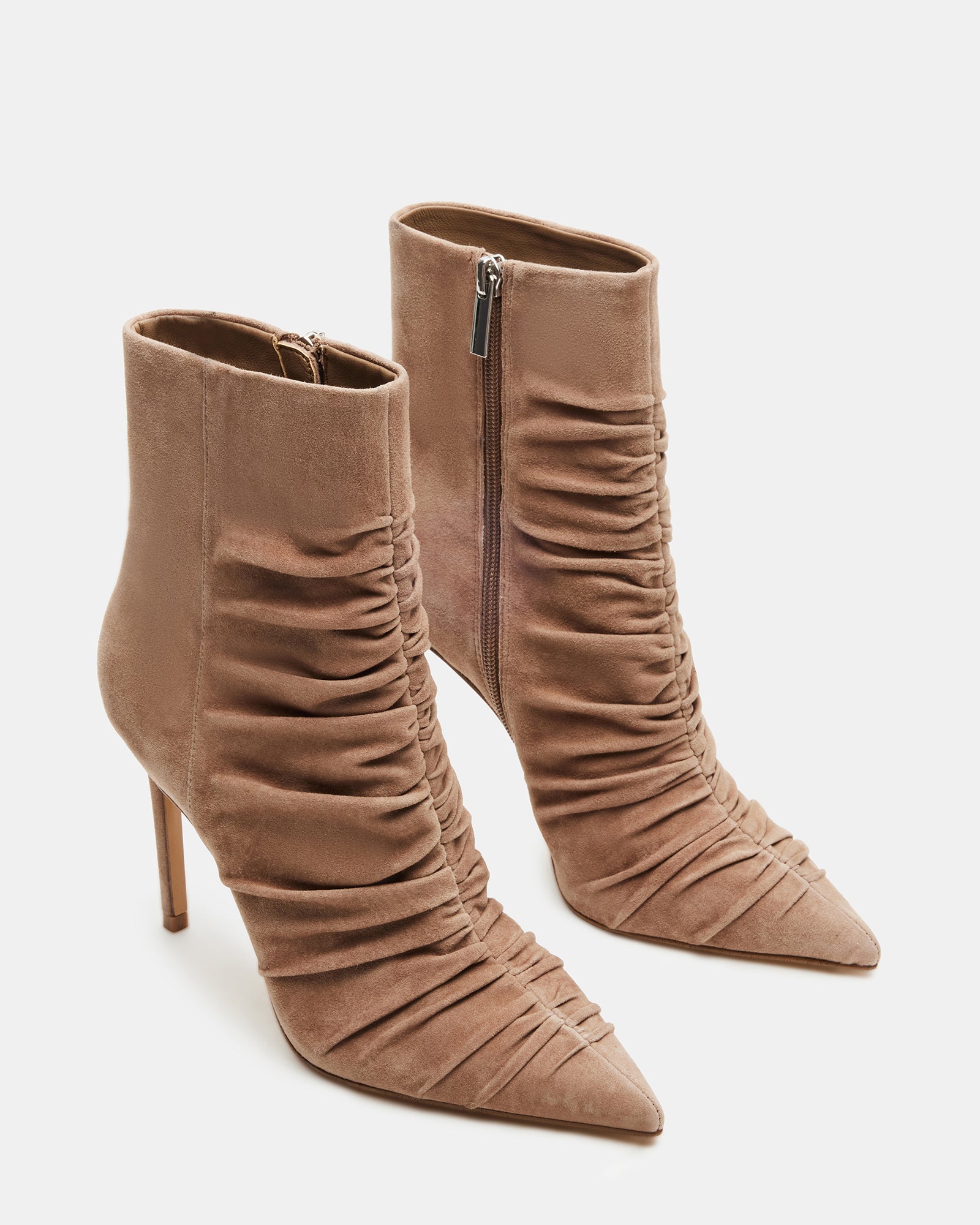 Back view showing heel height and sleek suede finish of the taupe bootie