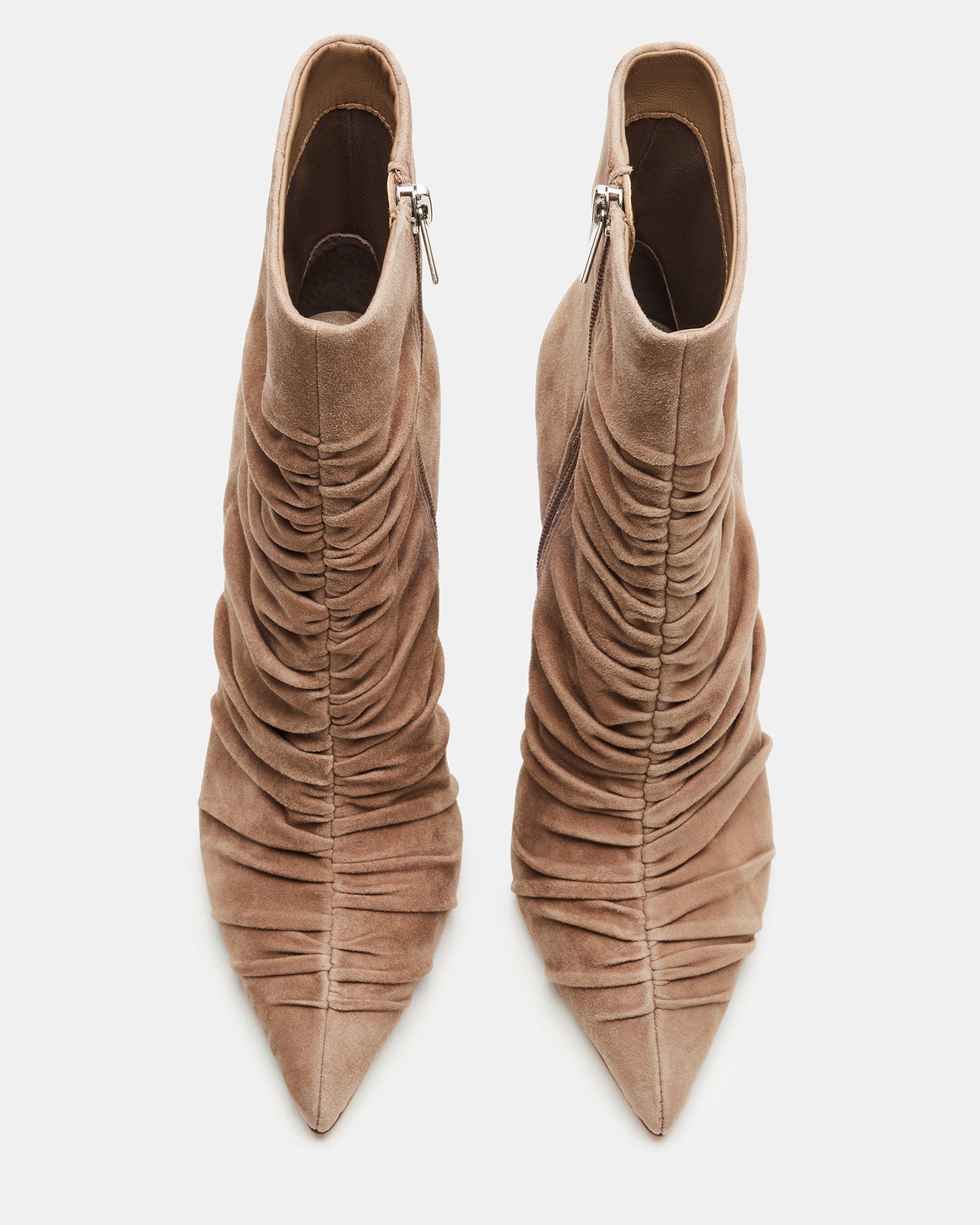 Side angle of taupe suede ankle bootie with ruched design and pointed stiletto heel