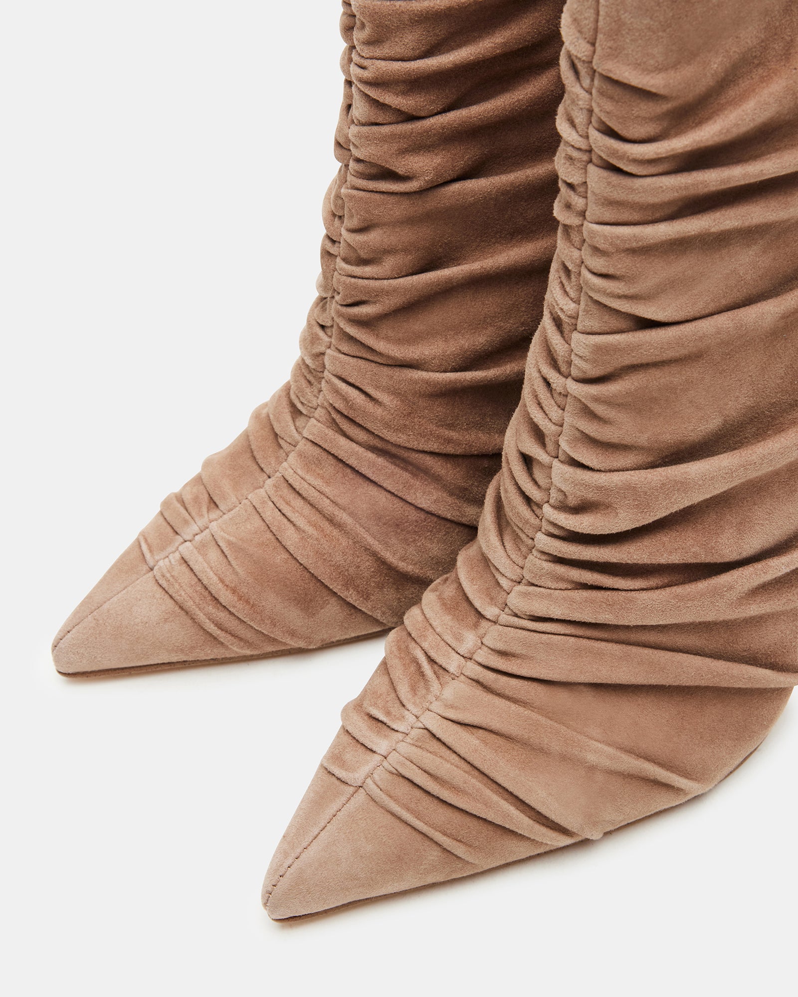 Styled outfit featuring taupe knee high suede boots and fall neutrals in a downtown setting