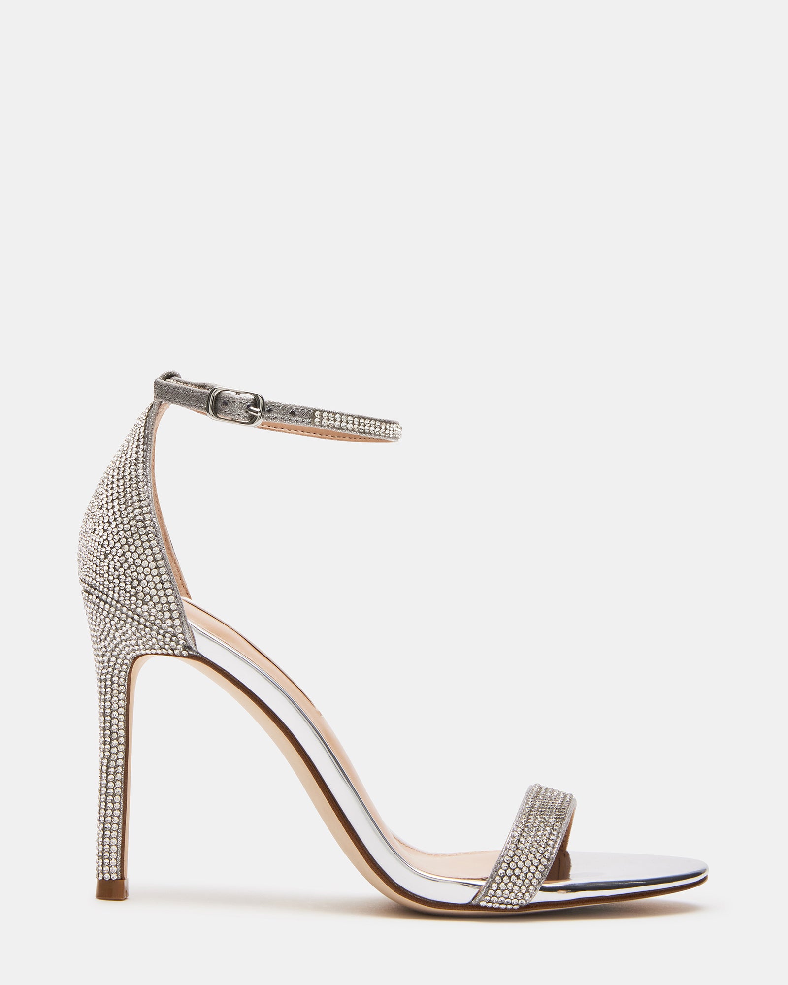 Tecy rhinestone sandals worn with a cocktail dress, showcasing the stiletto heel and sparkle.