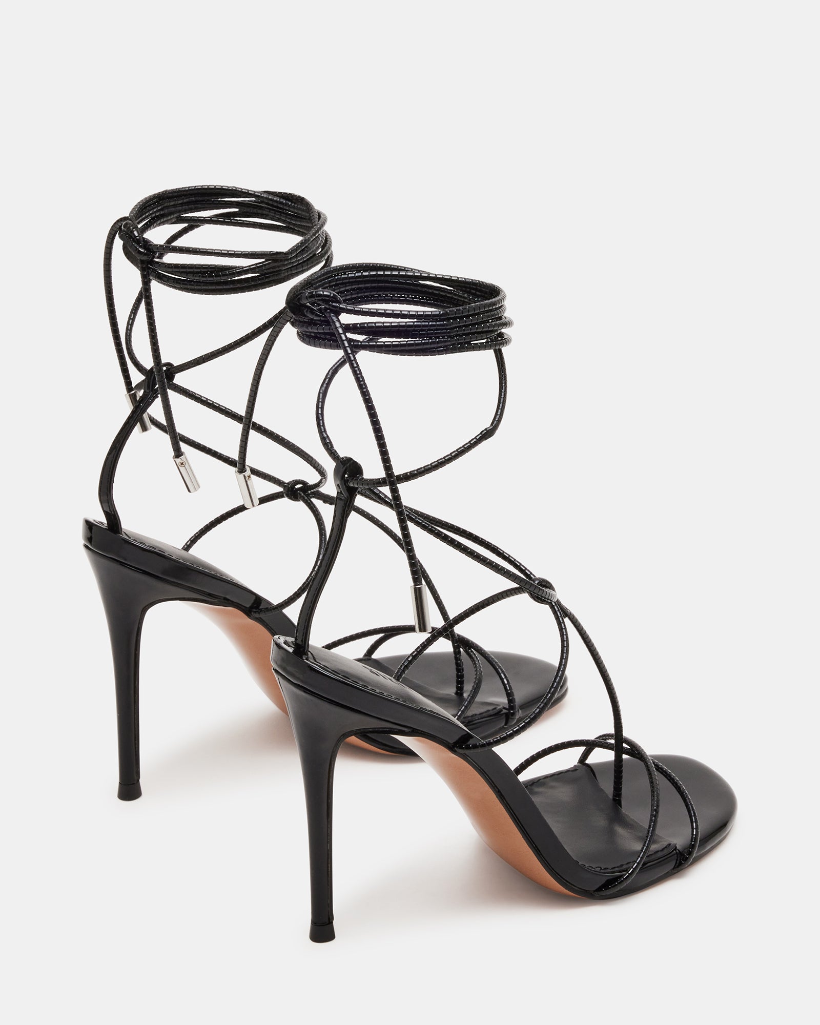 Close-up view of the strappy leg ties of the Temptation Noir high heel shoes.