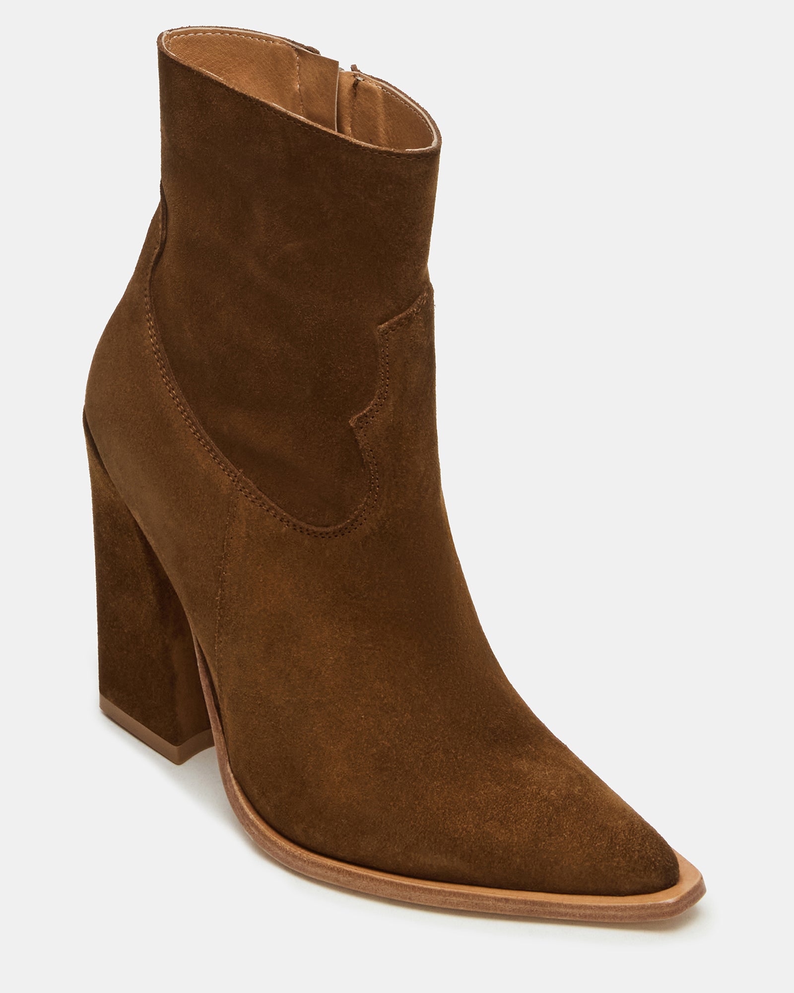 Front angle of black ankle boots styled with denim for casual wear