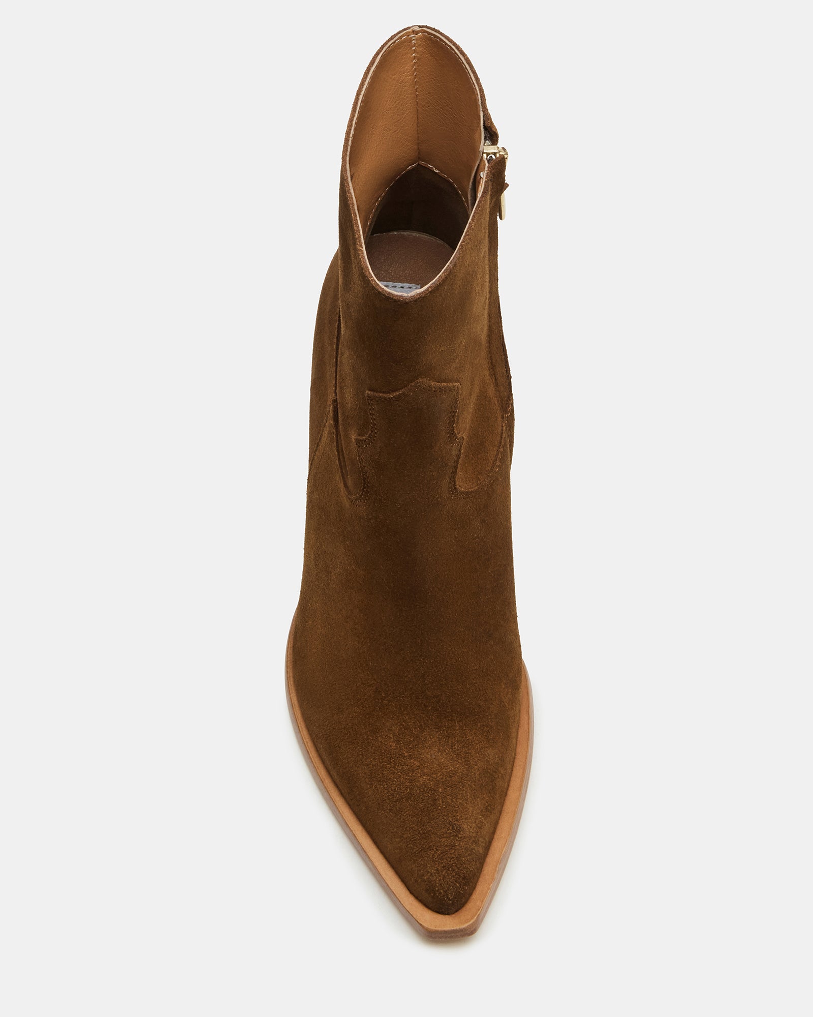 Side view of brown suede boots showing angular heel and zip closure