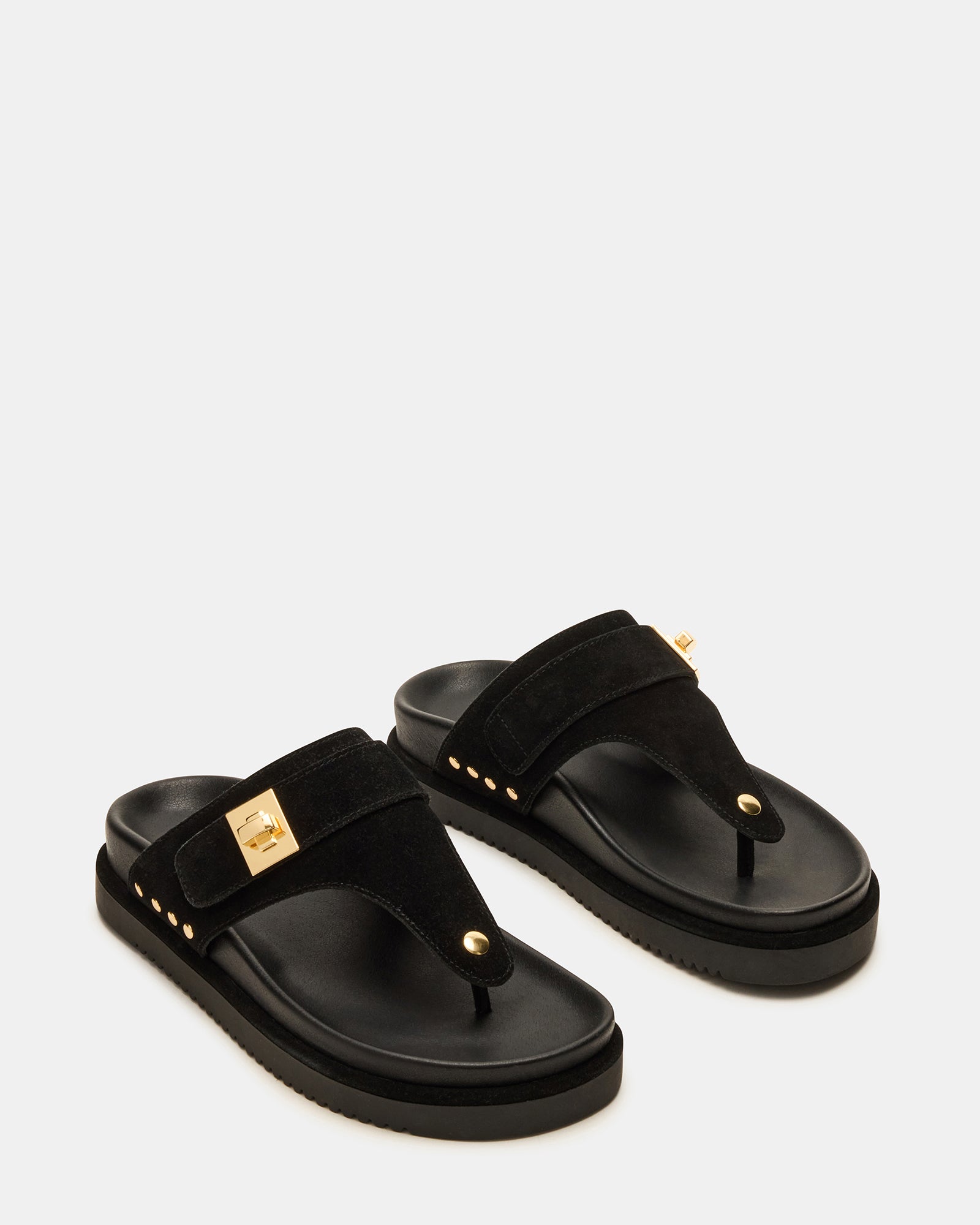 Model walking in black suede sandals with supportive platform