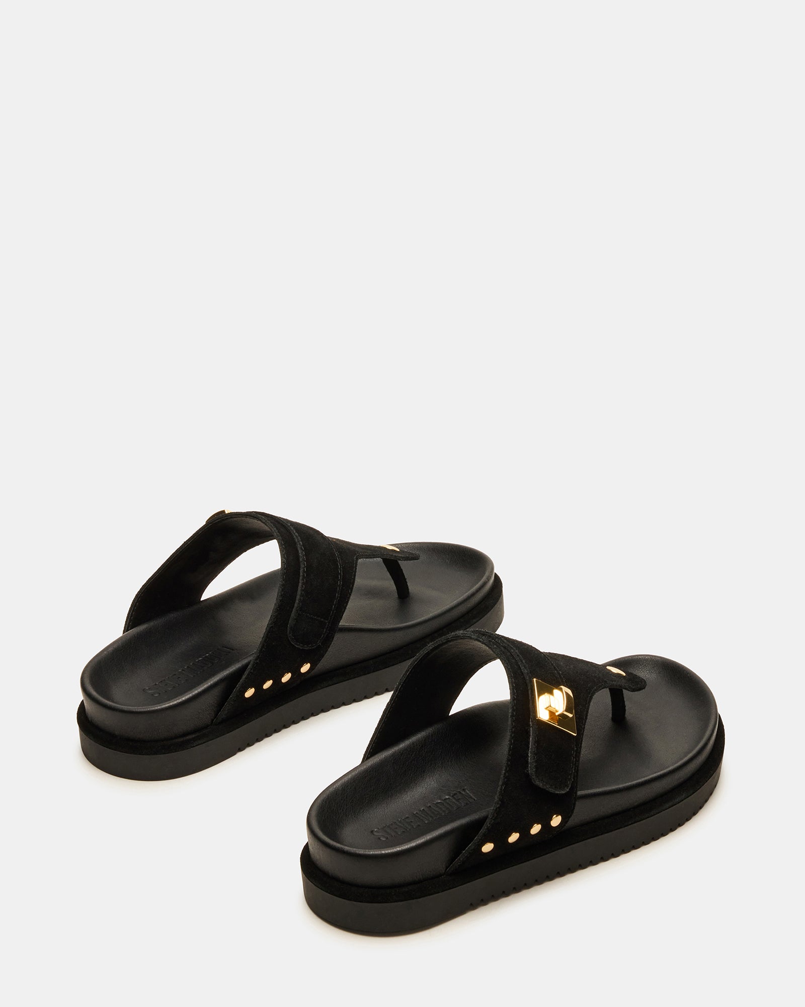 Model walking in black suede sandals with supportive platform
