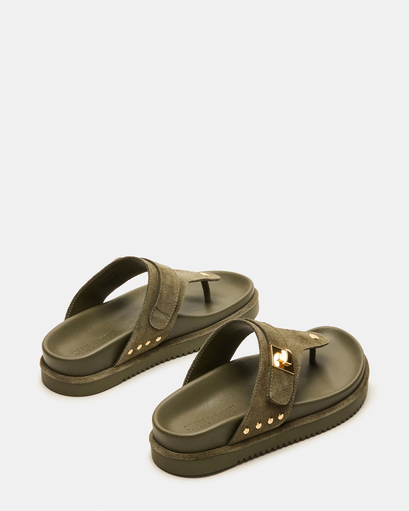 Top-down angle of thong sandal footbed and suede strap detail