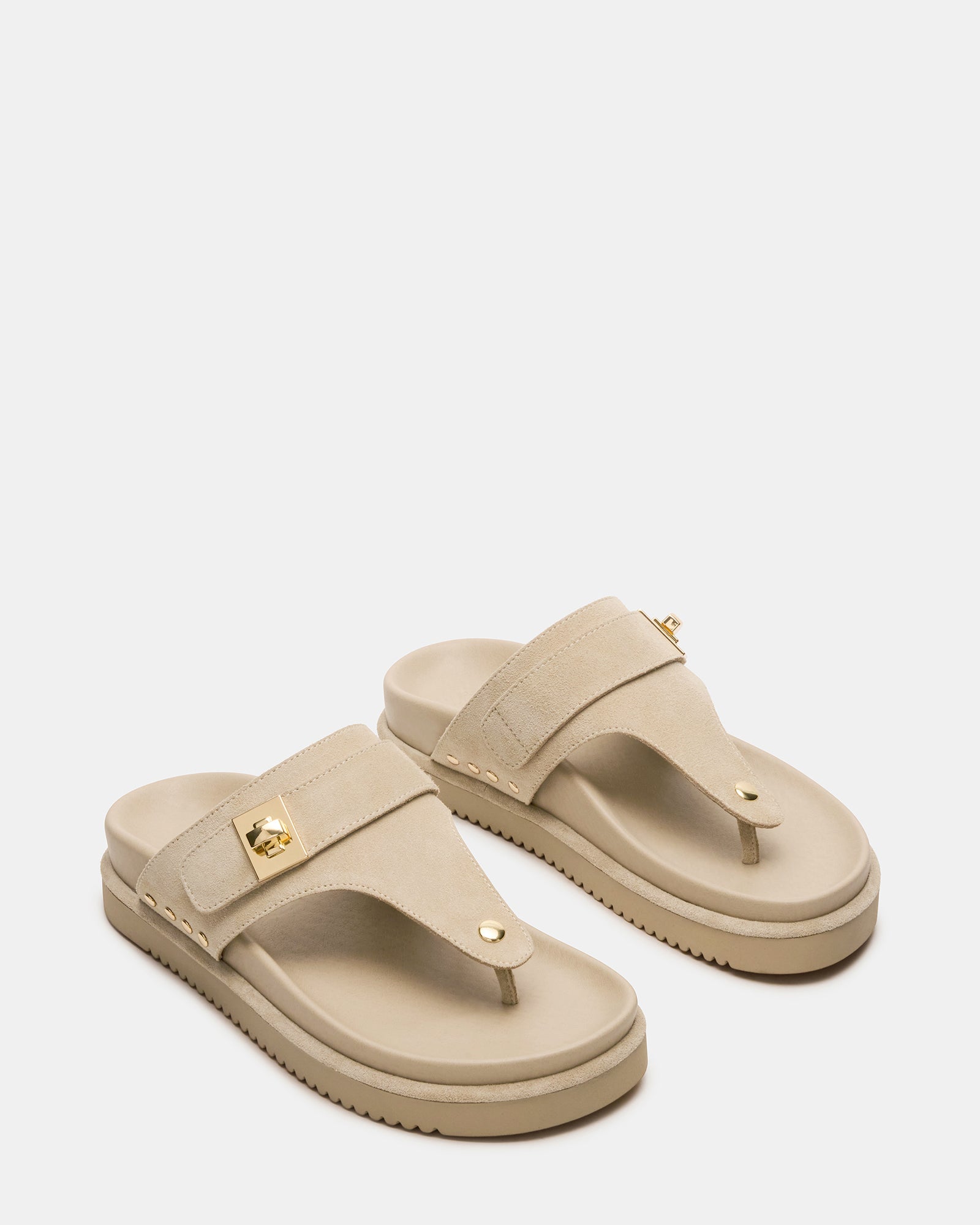 Close-up of black platform sandals showing synthetic sole and suede upper