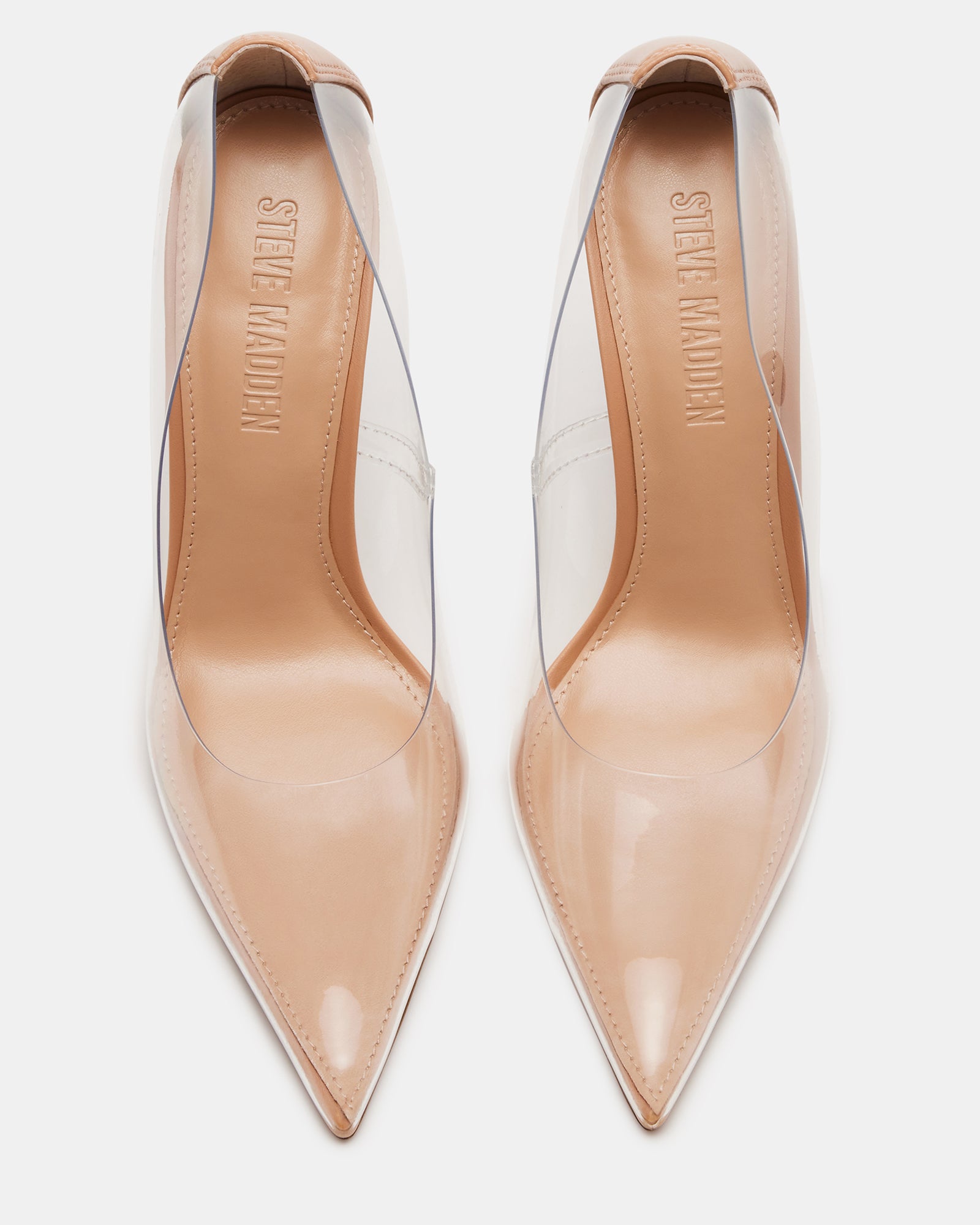 Fashionable women wearing transparent pumps with elegant outfit
