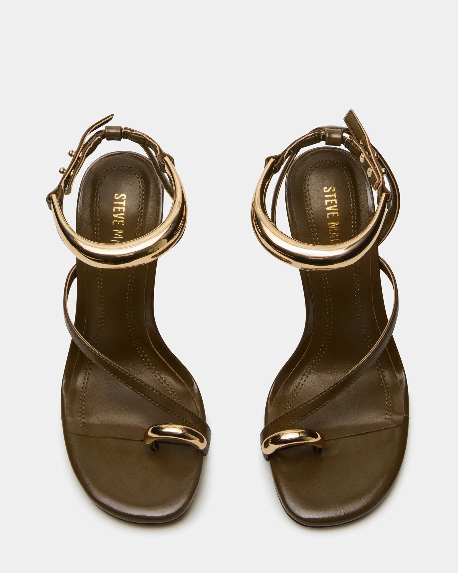Gold high heel sandals showcasing strappy design from the side.
