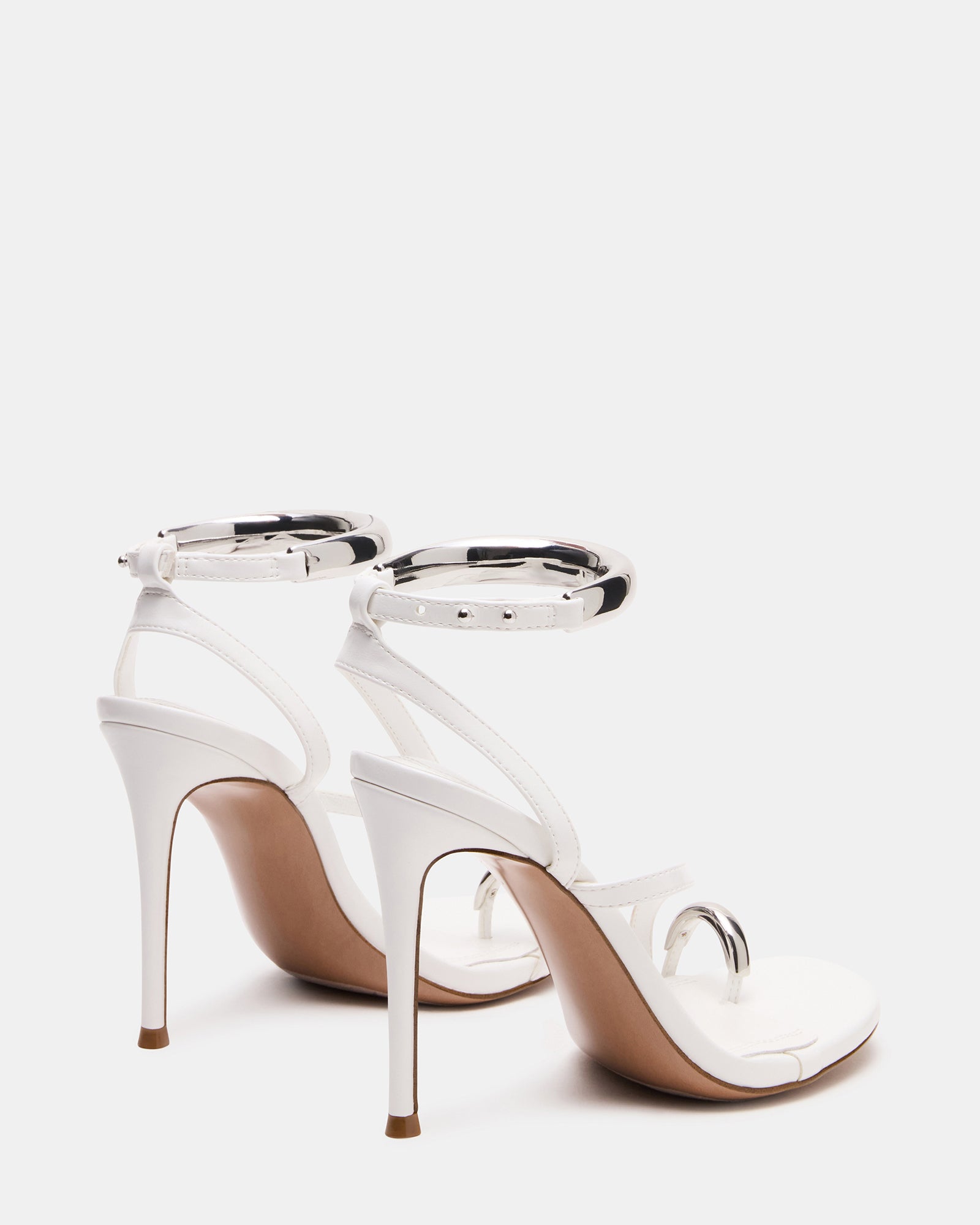 Model wearing Tia party heels with evening dress, full-length shot
