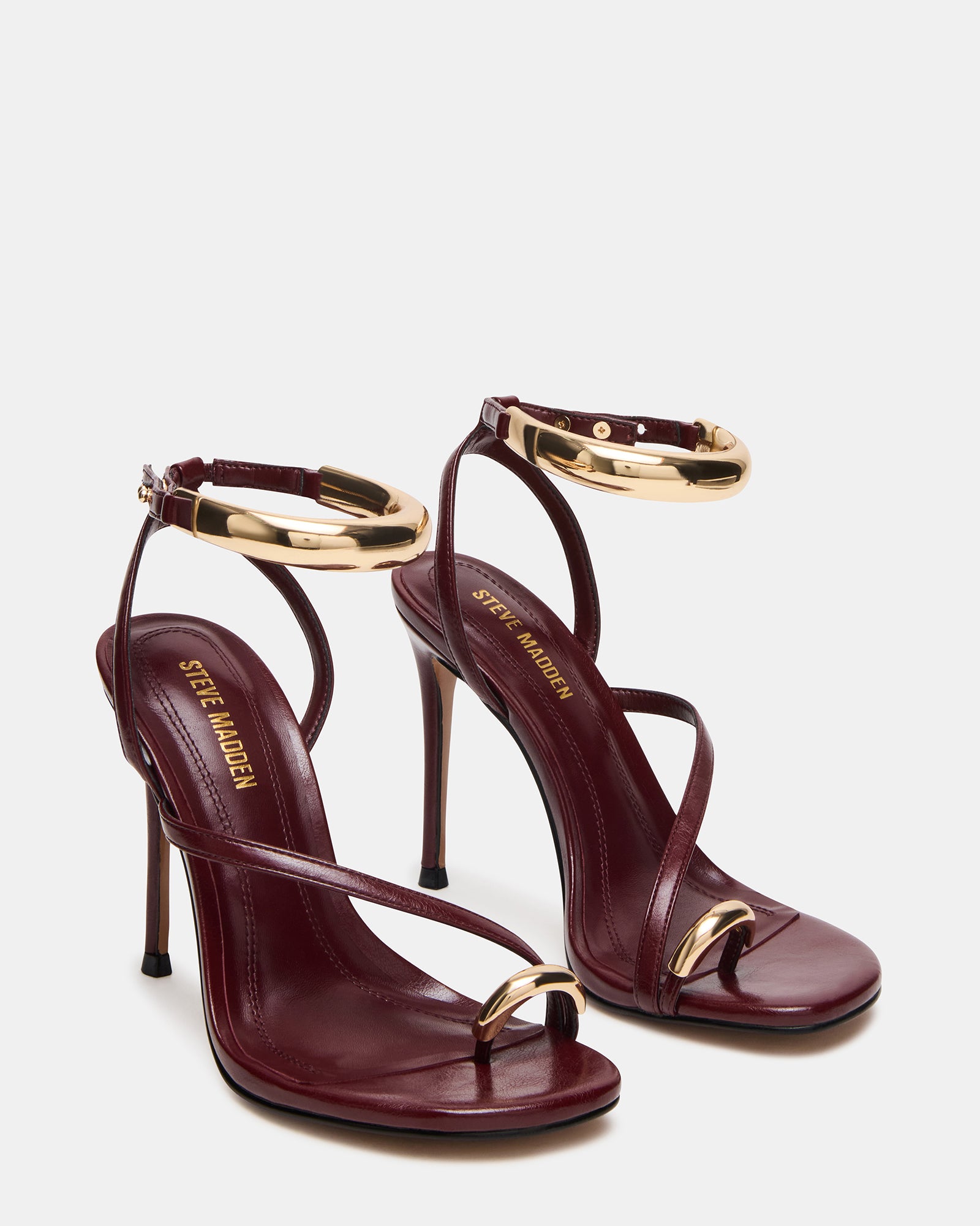 Close-up of gold hardware on Tia Wine heels
