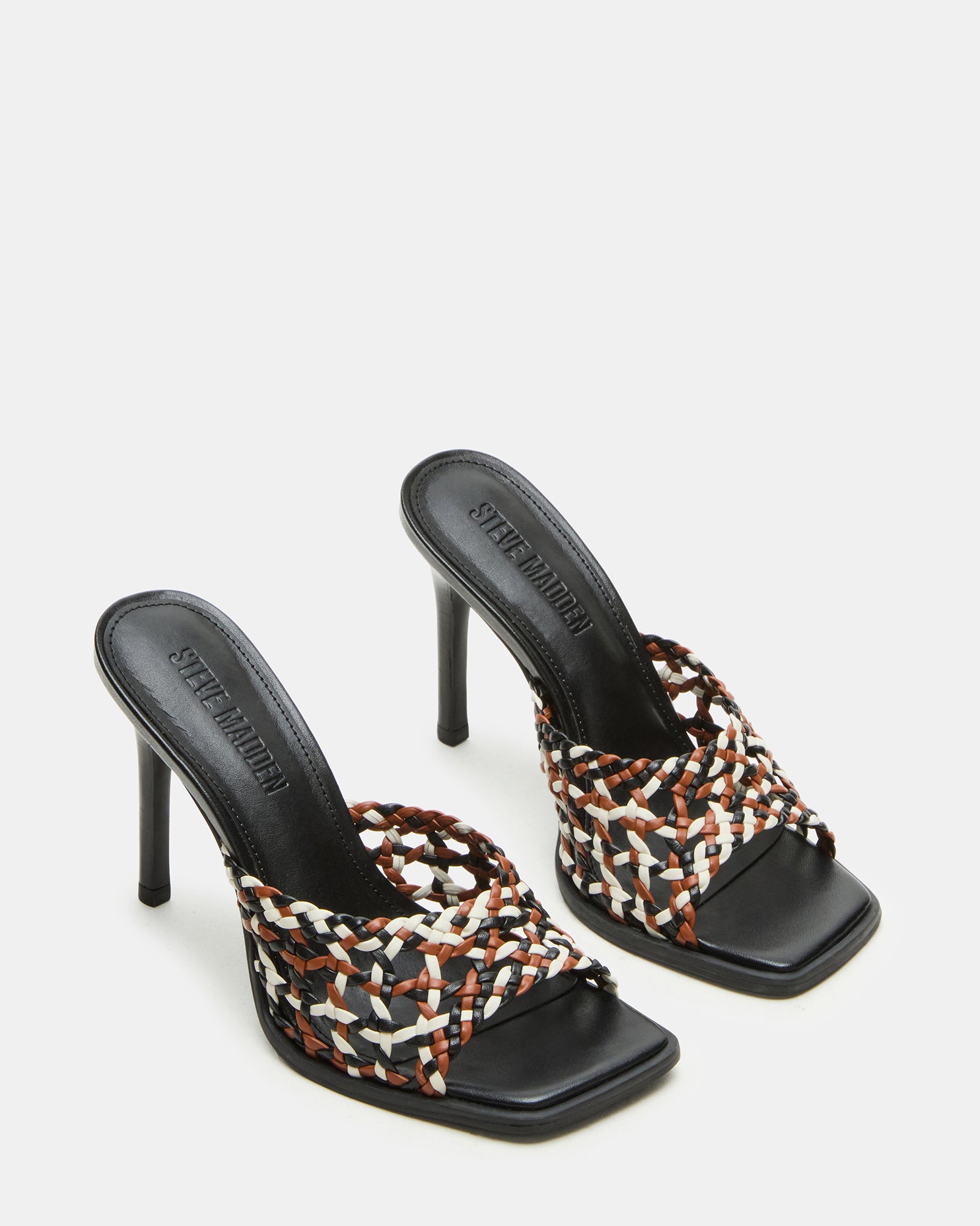 Side view of the womens mule heels featuring a 4-inch stiletto heel and synthetic upper