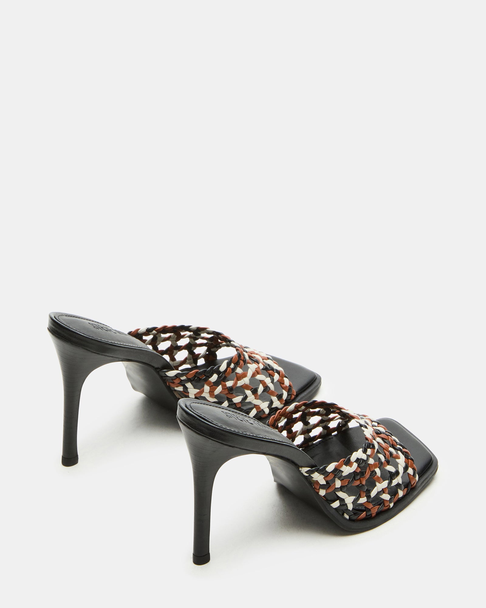 Side view of the womens mule heels featuring a 4-inch stiletto heel and synthetic upper