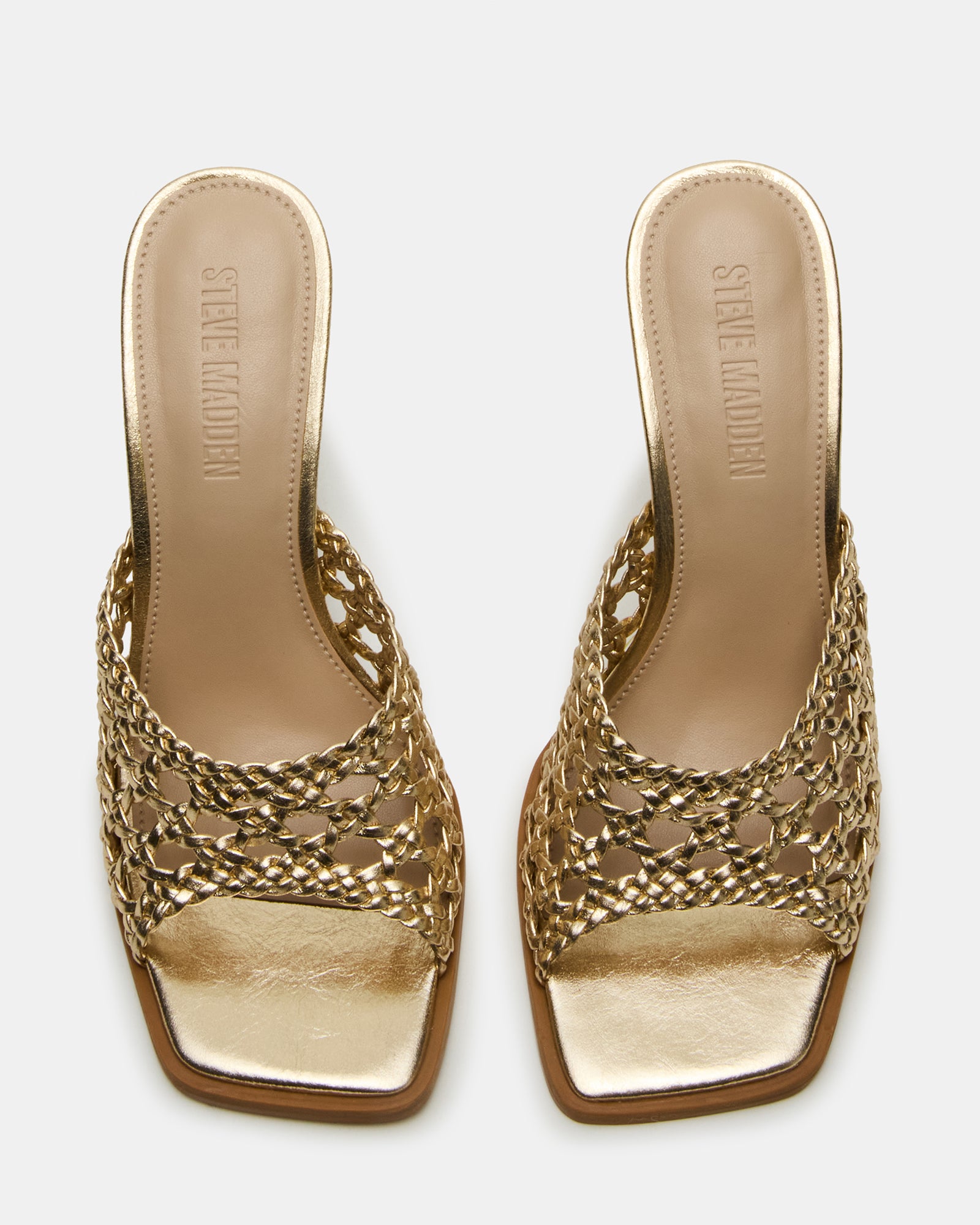 Black mule heels angled to show the stiletto heel and square toe