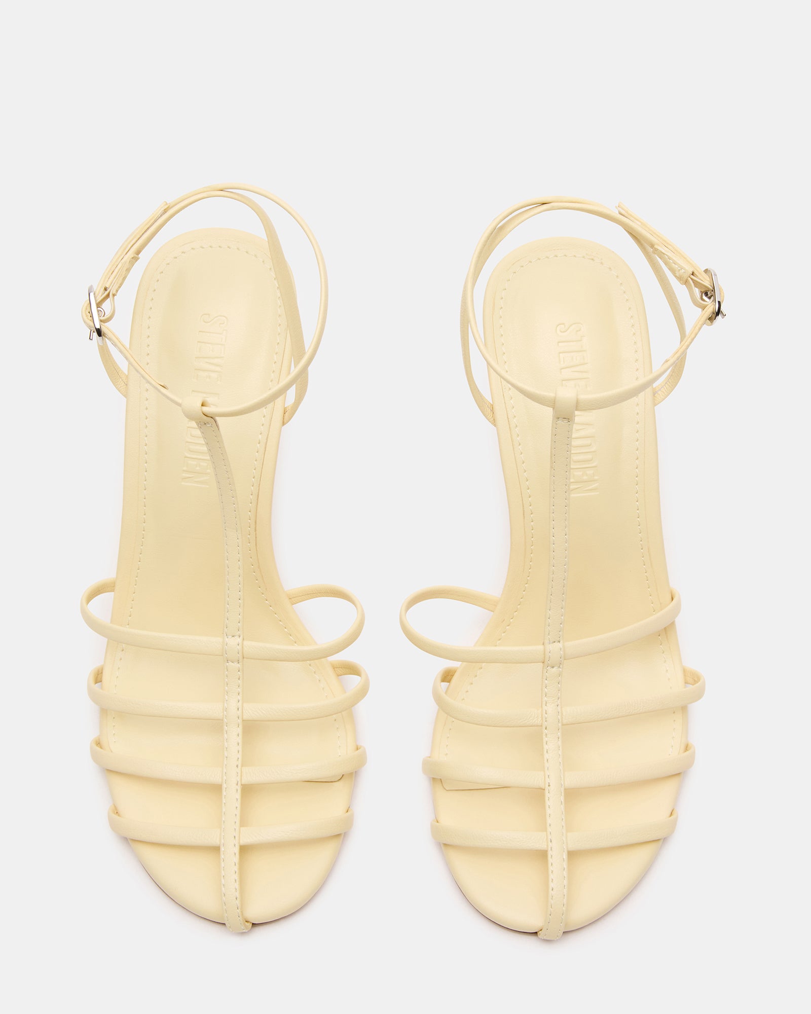 Gold strappy sandals paired with sunset cocktail dress for evening events