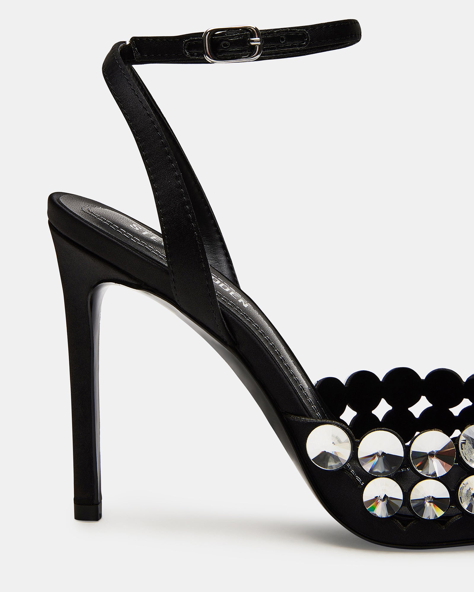 Side view of black stiletto heels with pointed toe and ankle strap
