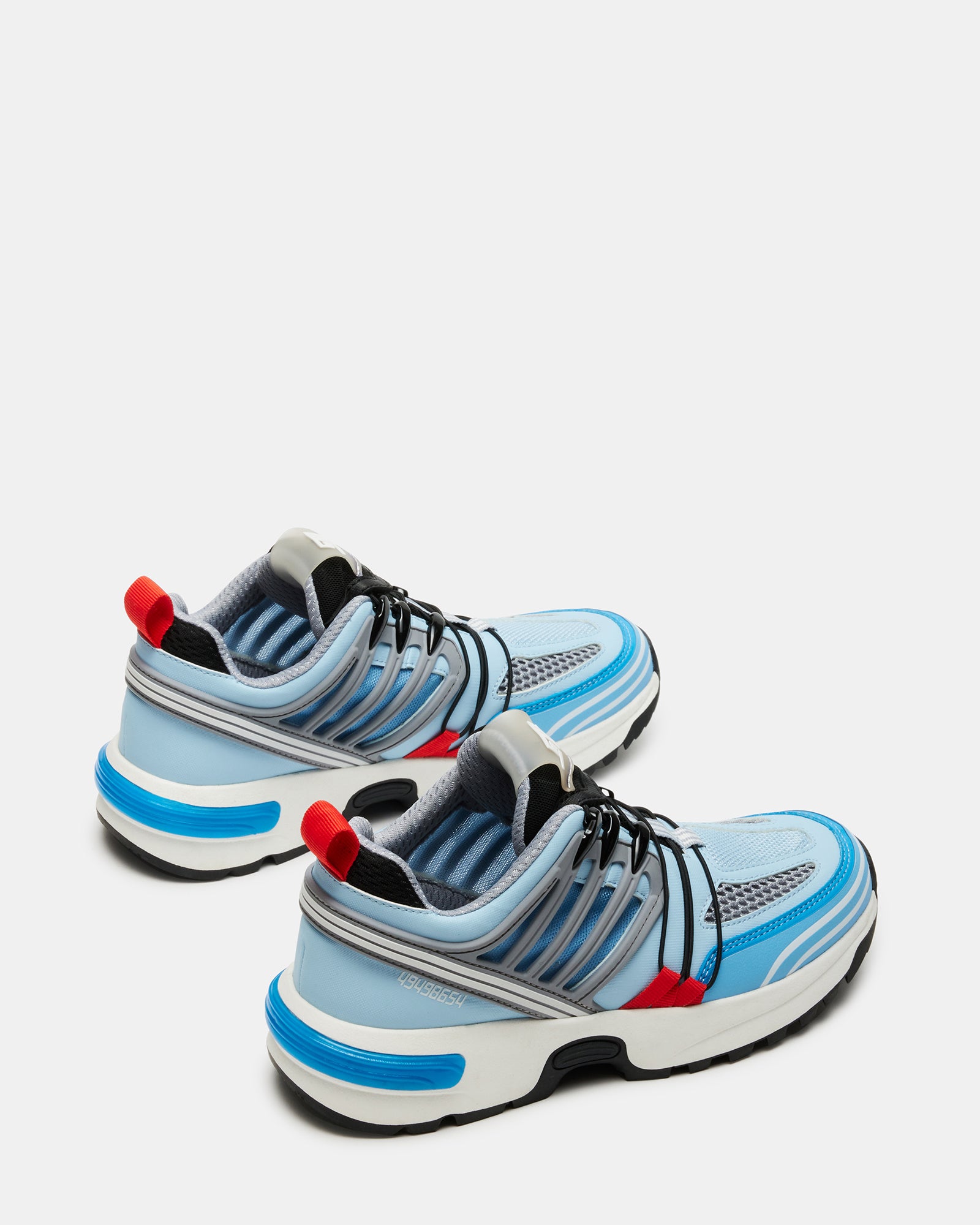 Tommy Blue fashion sneakers worn casually in an outdoor setting