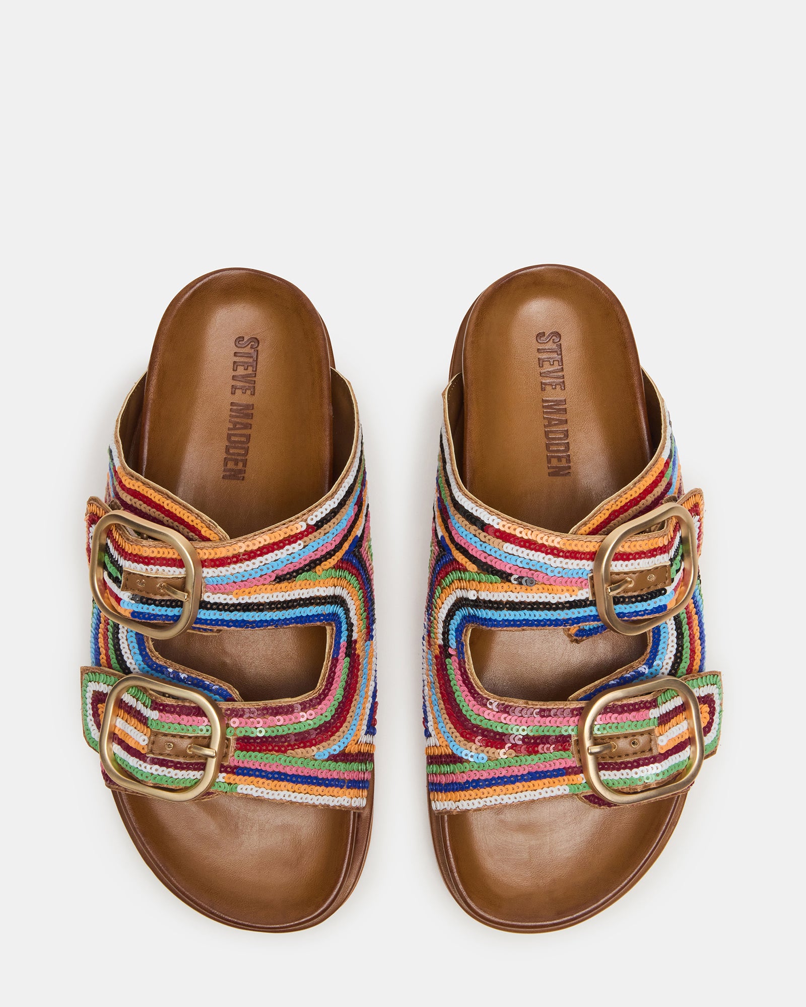 Close-up of sequin embellishments on slide sandals, ideal for warm climates