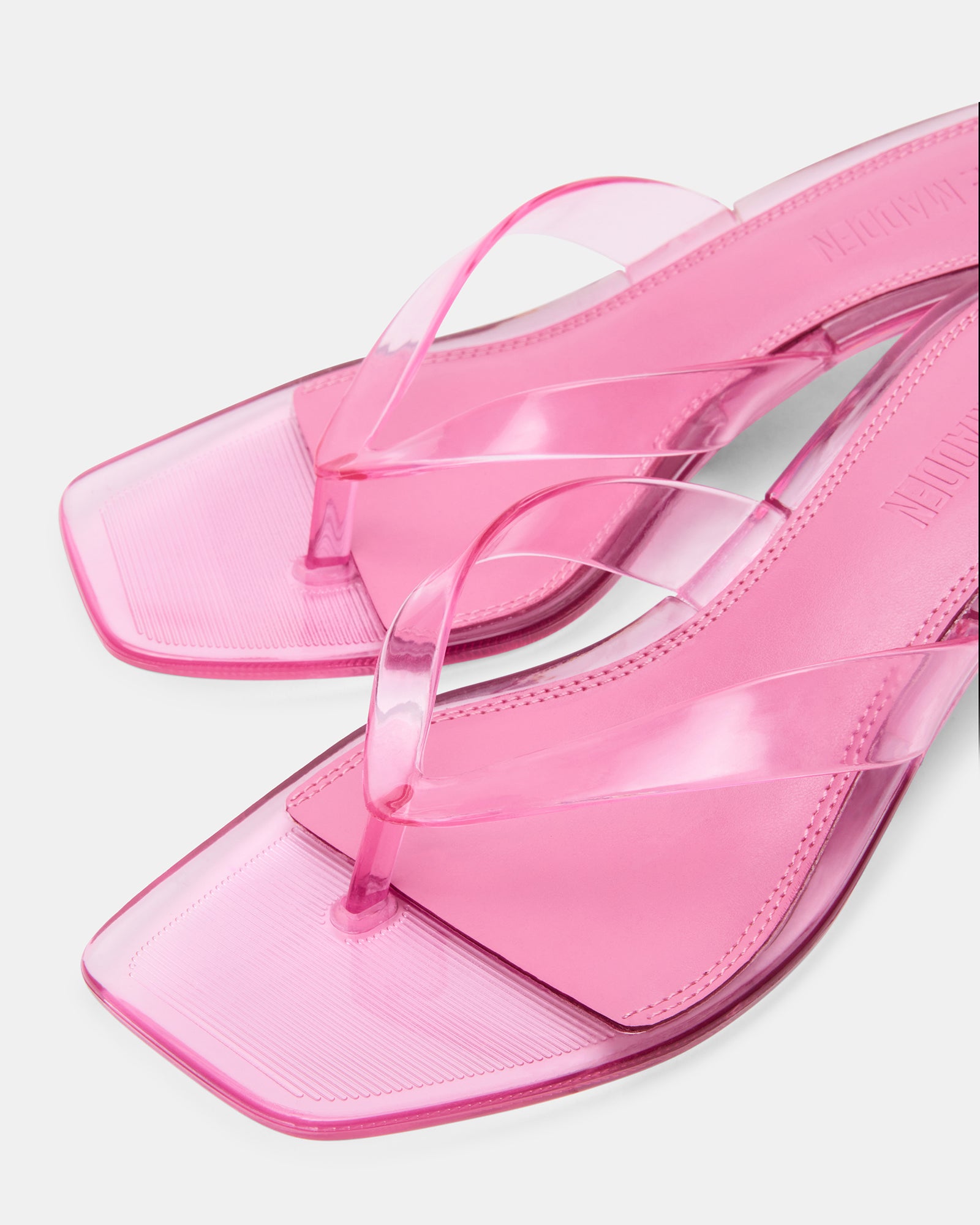 Tracie jelly pink kitten heel sandals from the side, showcasing the thong strap.