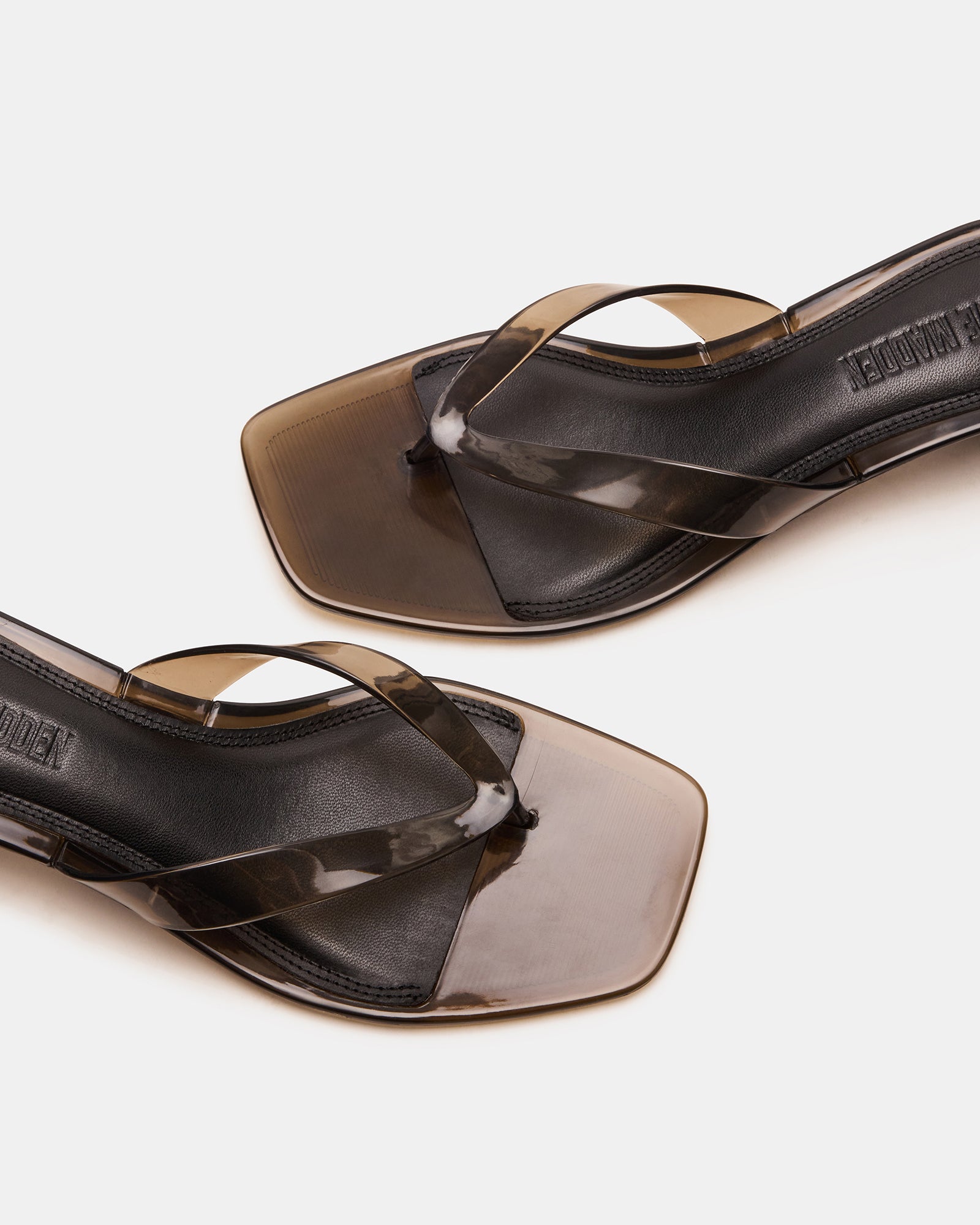 Side view of Tracie Jelly Smoke kitten heel sandals with thong strap.