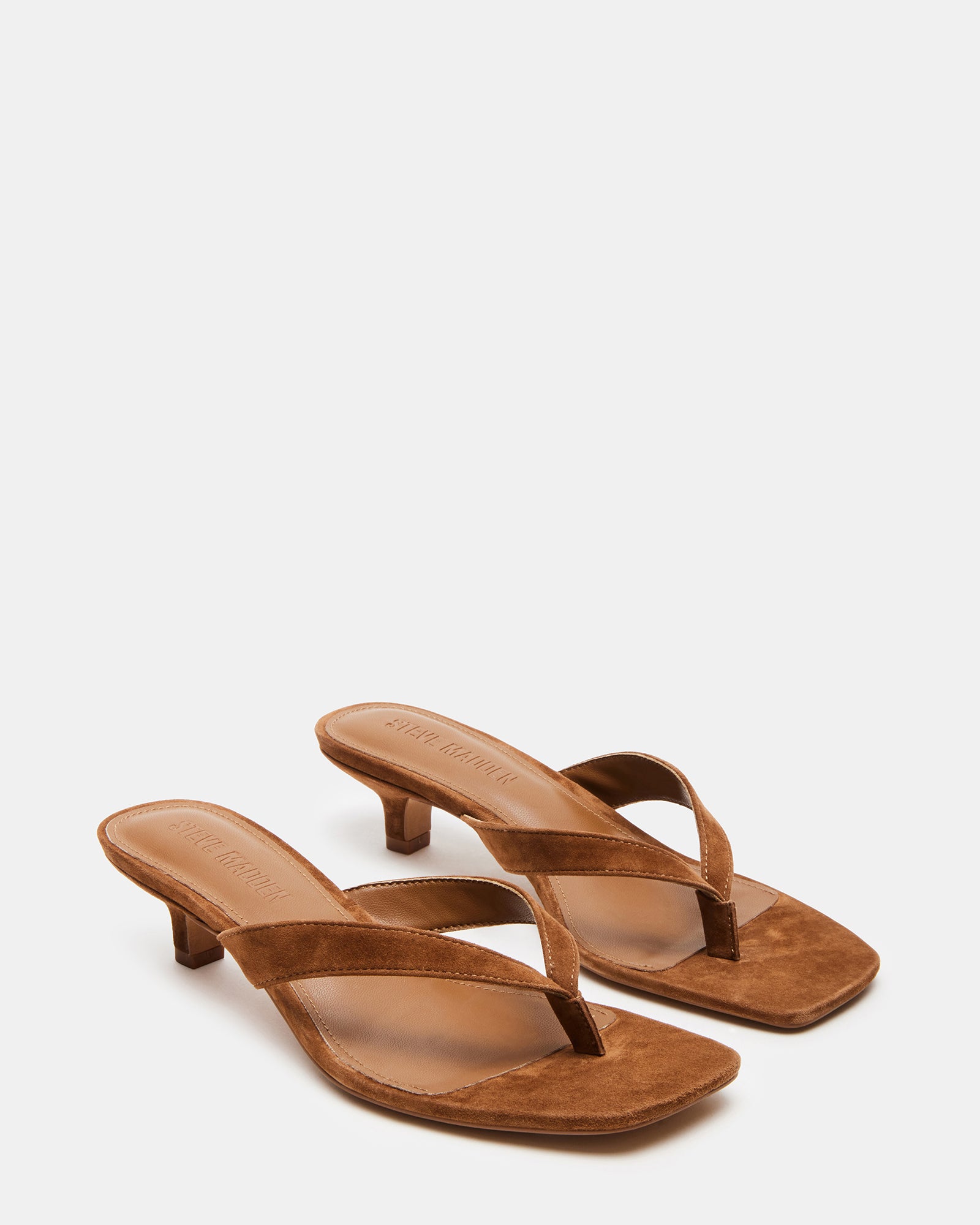 Close-up of Tracie brown suede shoes, emphasizing the luxurious texture and 2-inch heel.