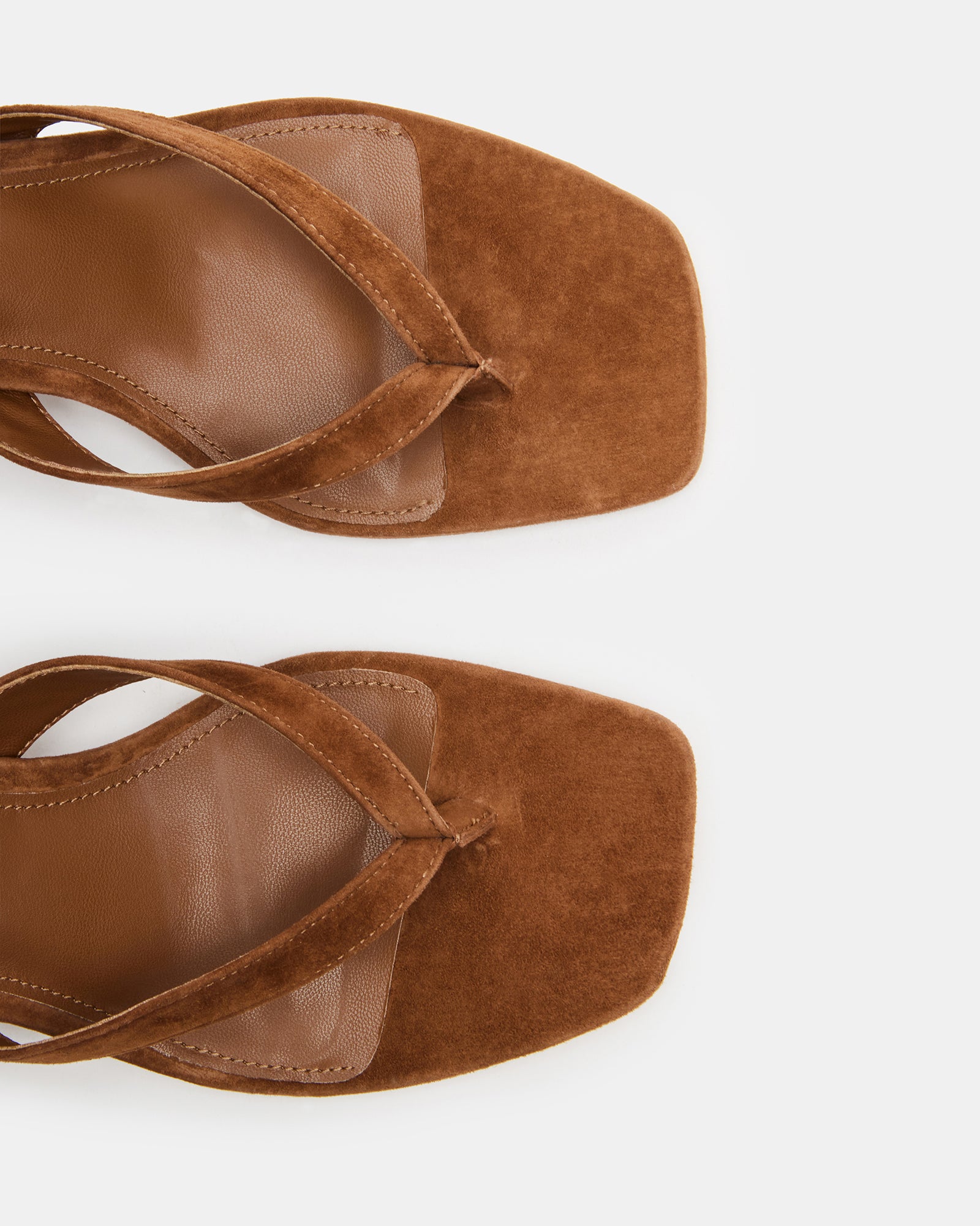 Side view of Tracie brown suede heeled shoes showcasing the chic thong strap.