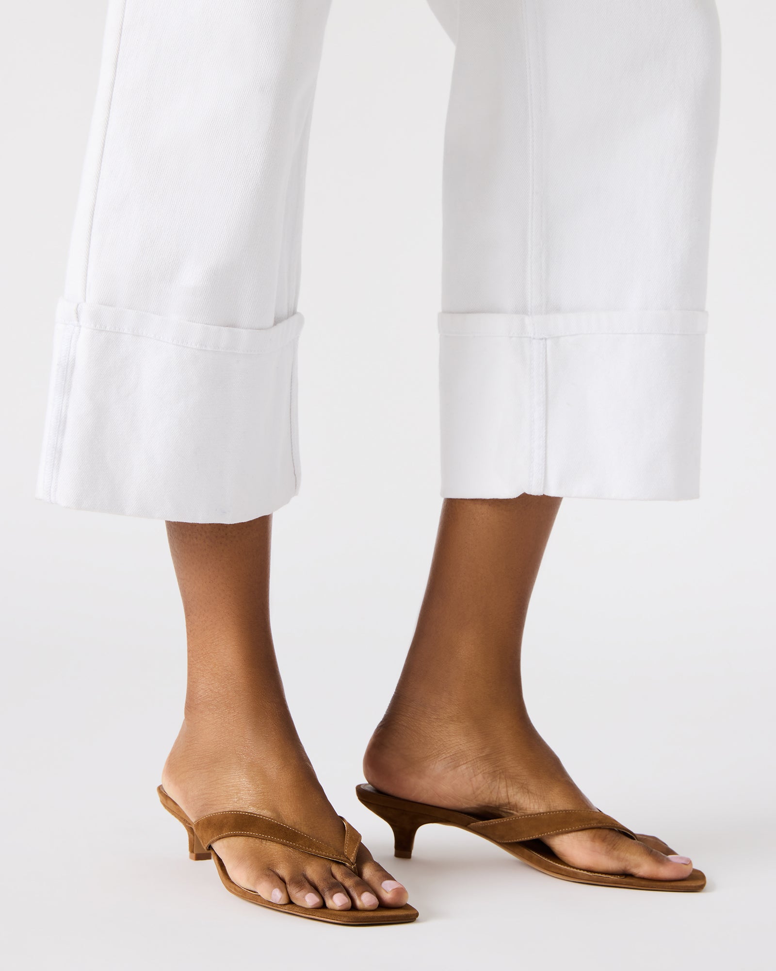 Tracie kitten heel shoes displayed on a wooden surface, highlighting the square toe design.