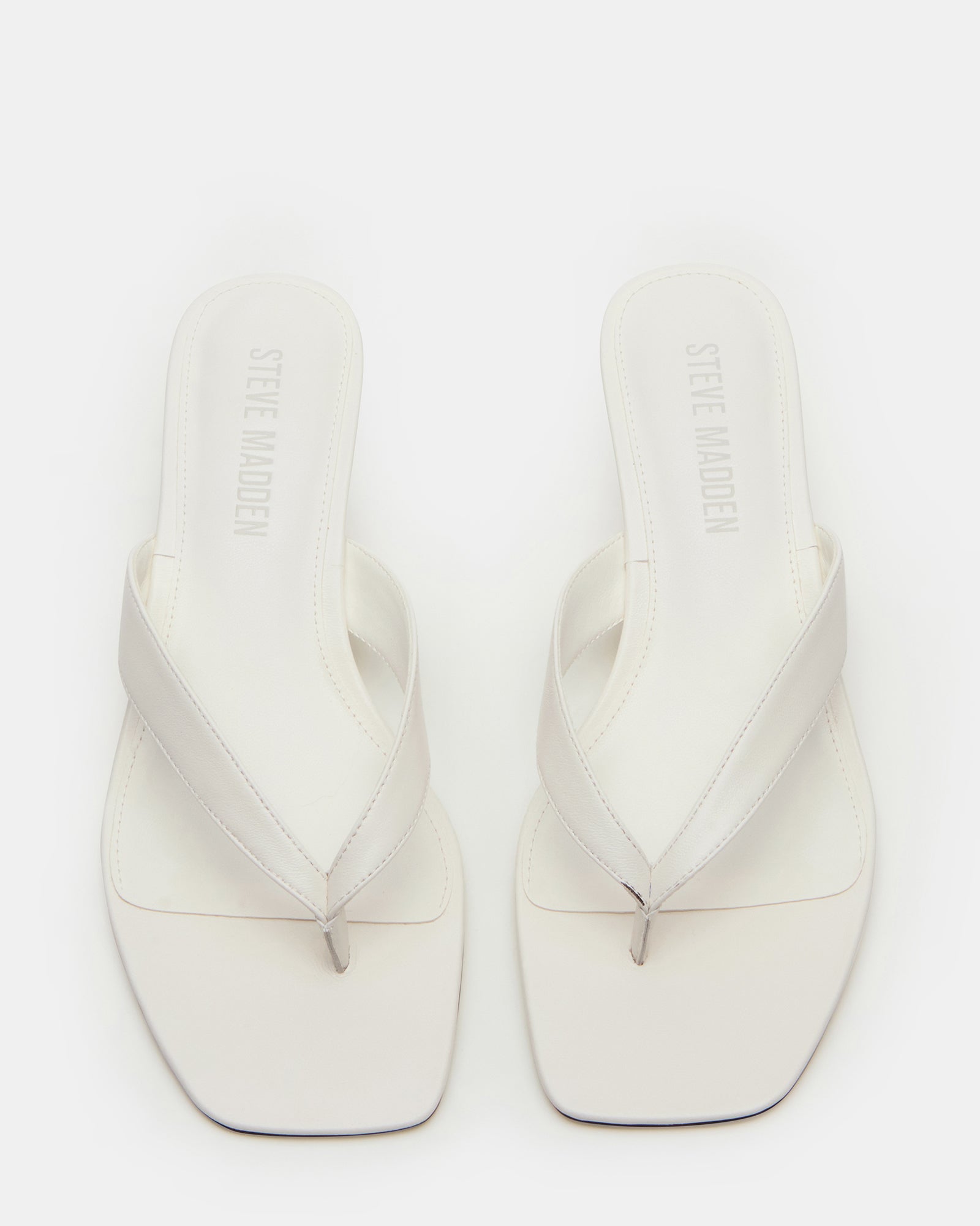 Side view of TRACIE white leather heels highlighting the square toe and comfortable heel height