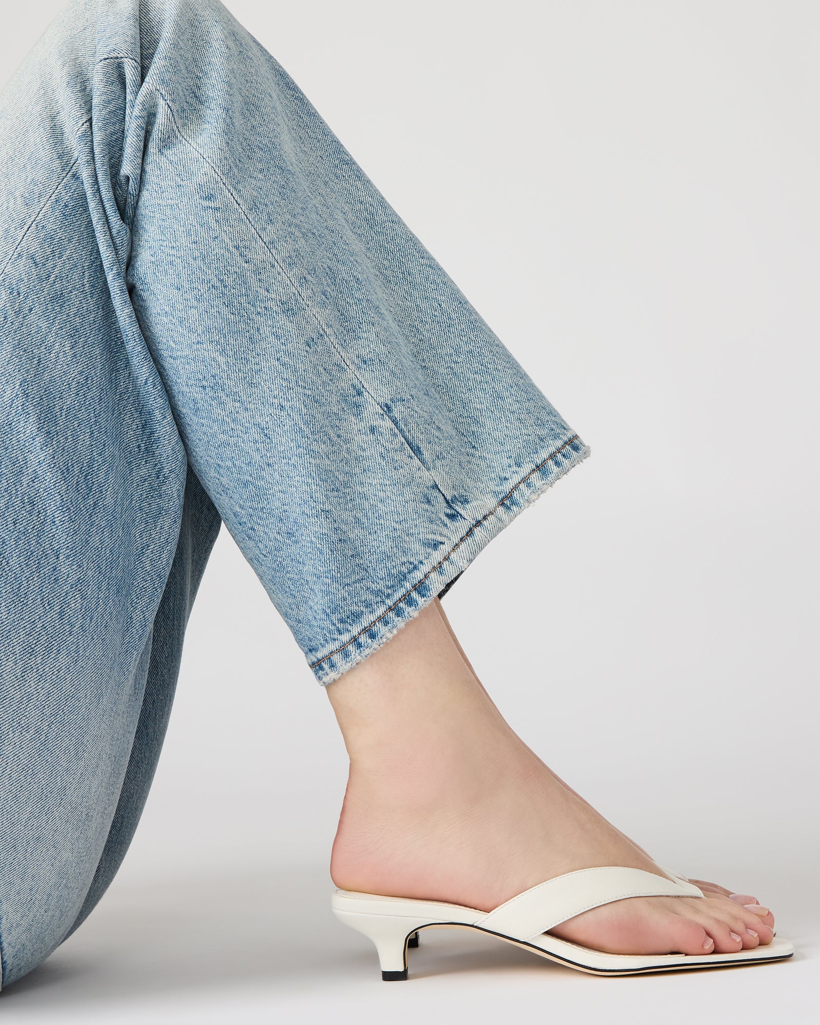 Side view of TRACIE white leather heels highlighting the square toe and comfortable heel height